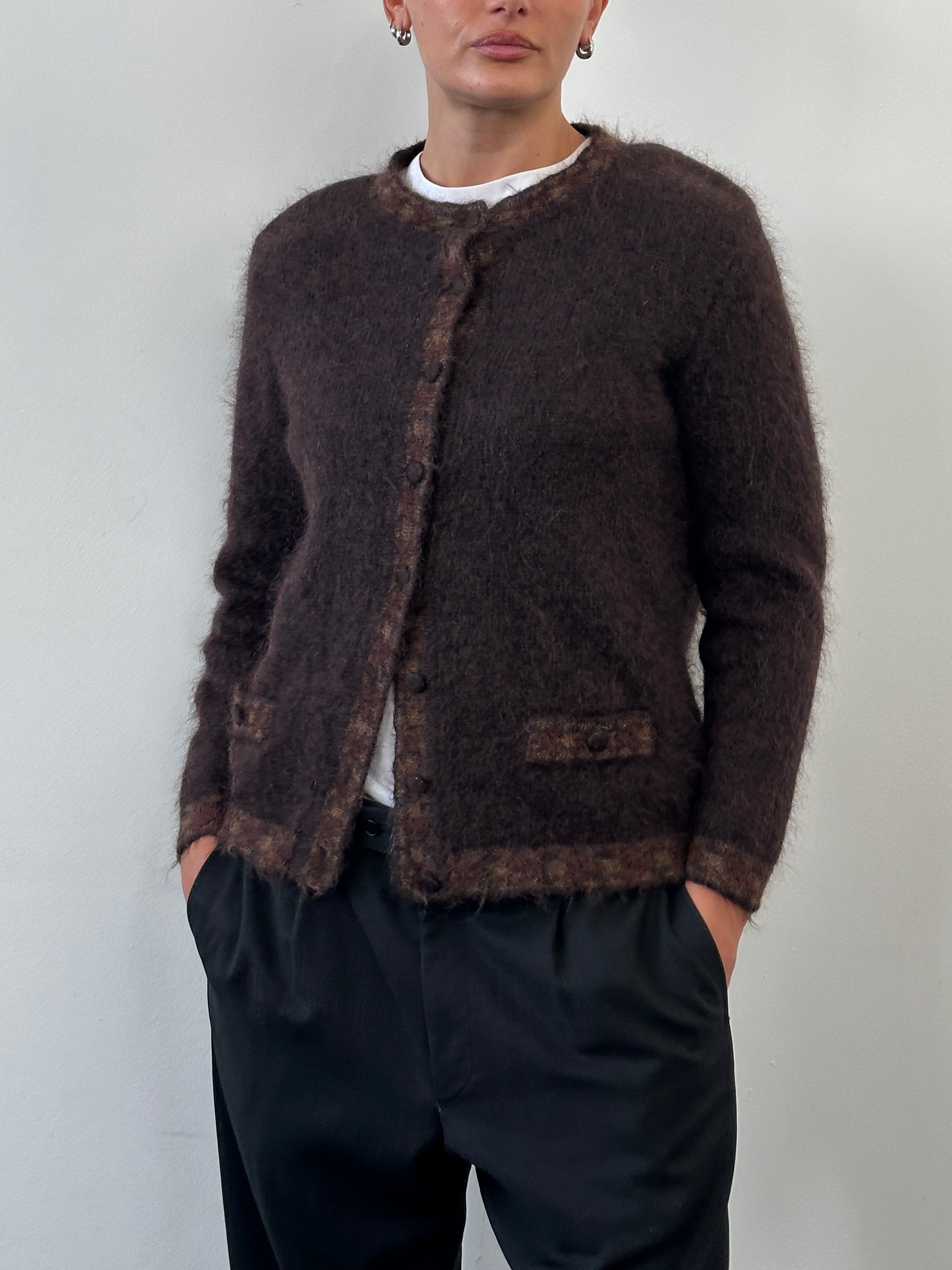 Italian vintage 1990s mohair cardigan in cream with a cozy, textured knit, featuring a classic design and button closure.