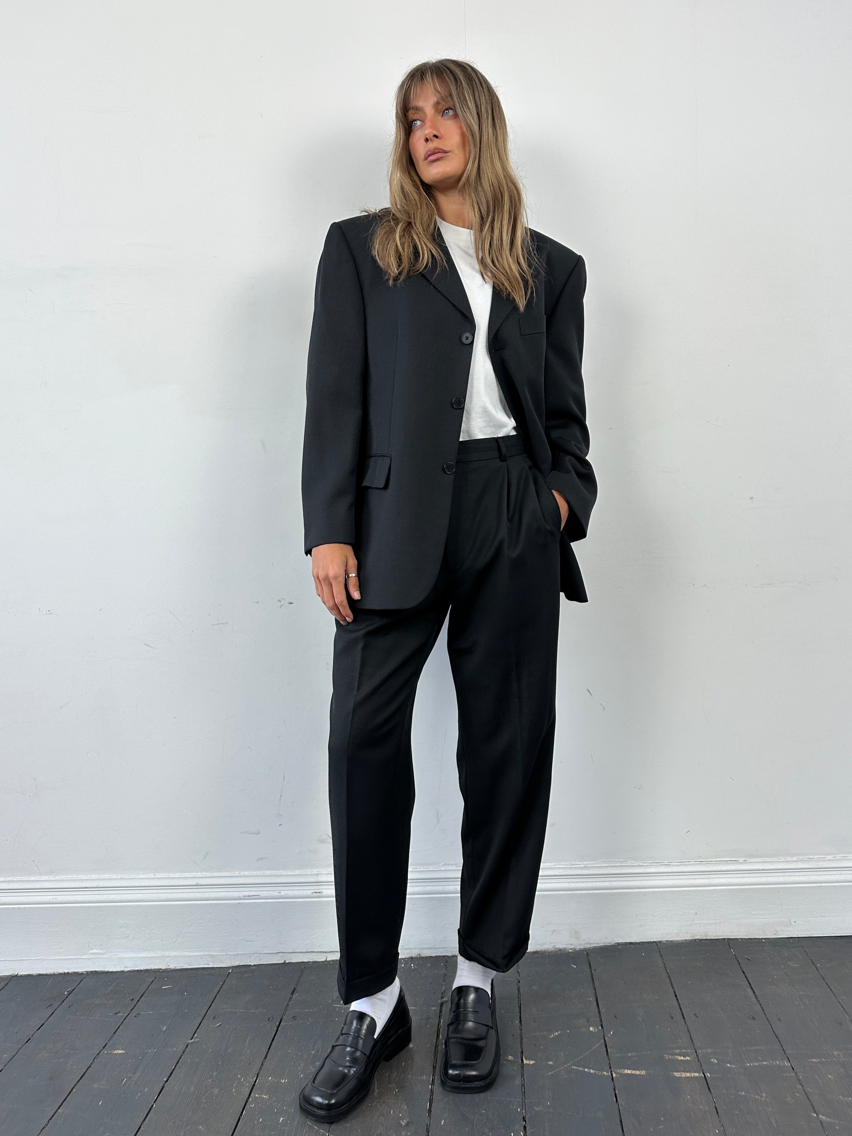Pierre Cardin wool single-breasted jumpsuit in size 40S/W30, tailored fit with lapel collar and front buttons.