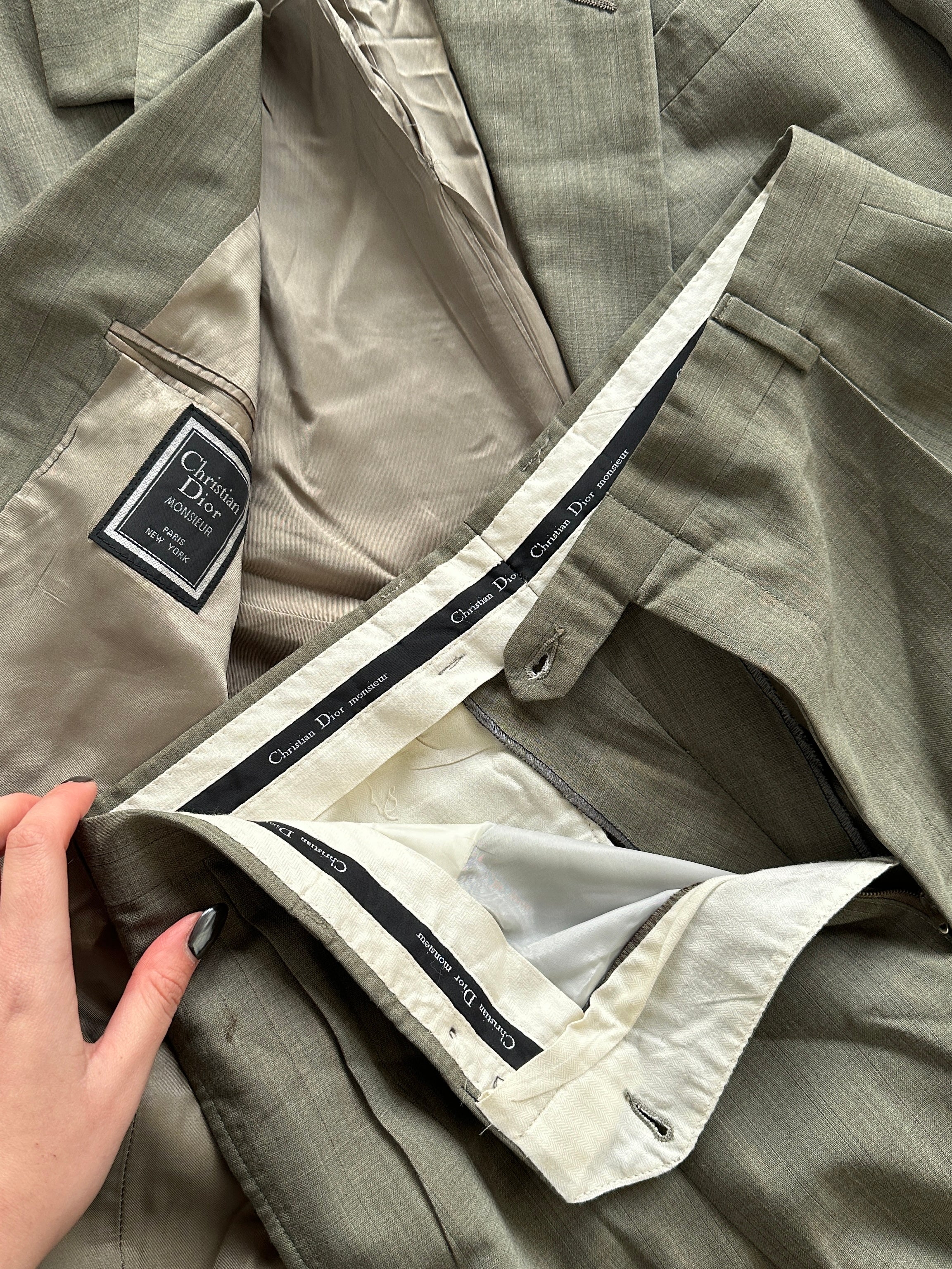 Christian Dior pure virgin wool single-breasted suit jumpsuit in size 42R/W32, tailored fit with classic lapel and button closure.