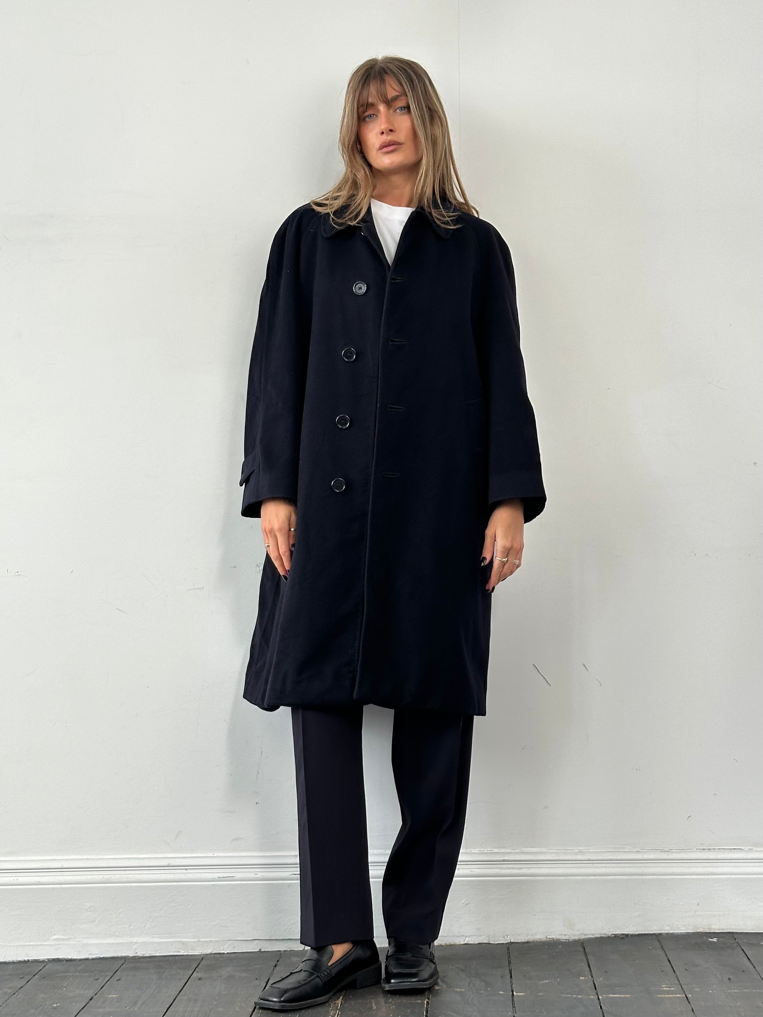 Burberry Pure Cashmere single-breasted coat in size L, shown hanging with classic design and neutral color fabric.