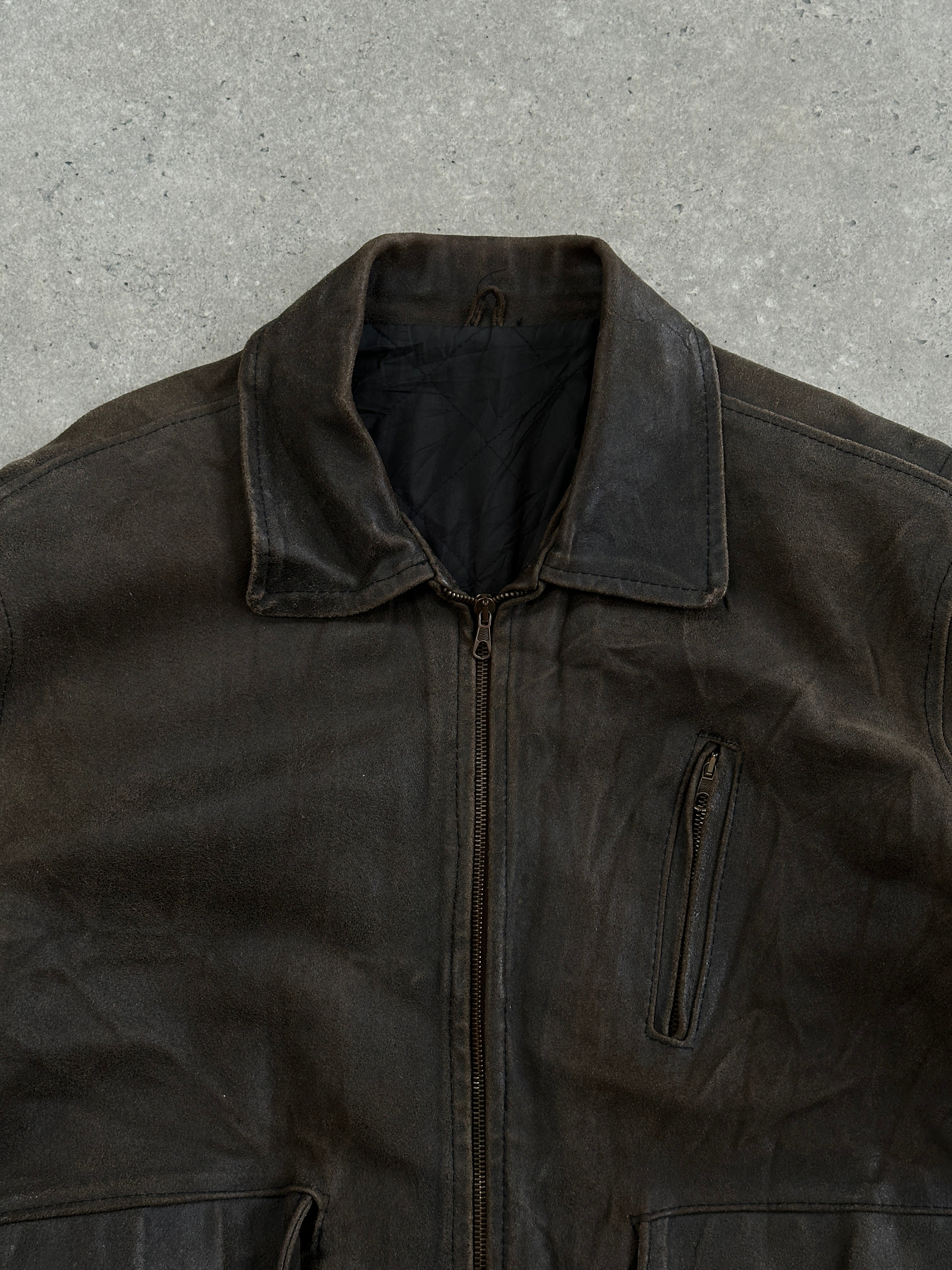 Vintage Italian 1980s distressed leather jacket, XL size, showcasing rugged texture and classic style.