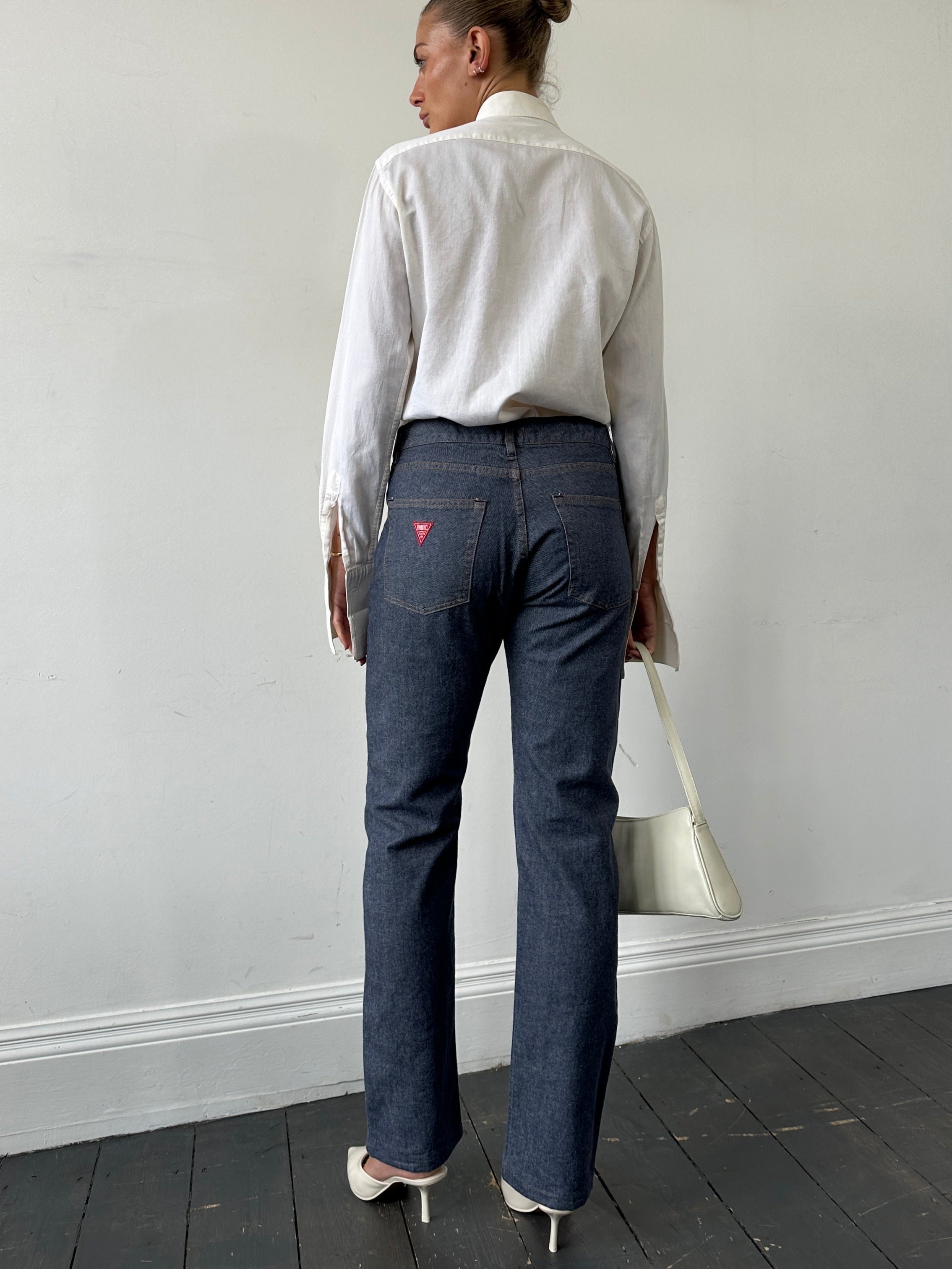 Fiorucci 1990s high waisted straight leg denim jeans in W32, showcasing classic blue wash and vintage style.