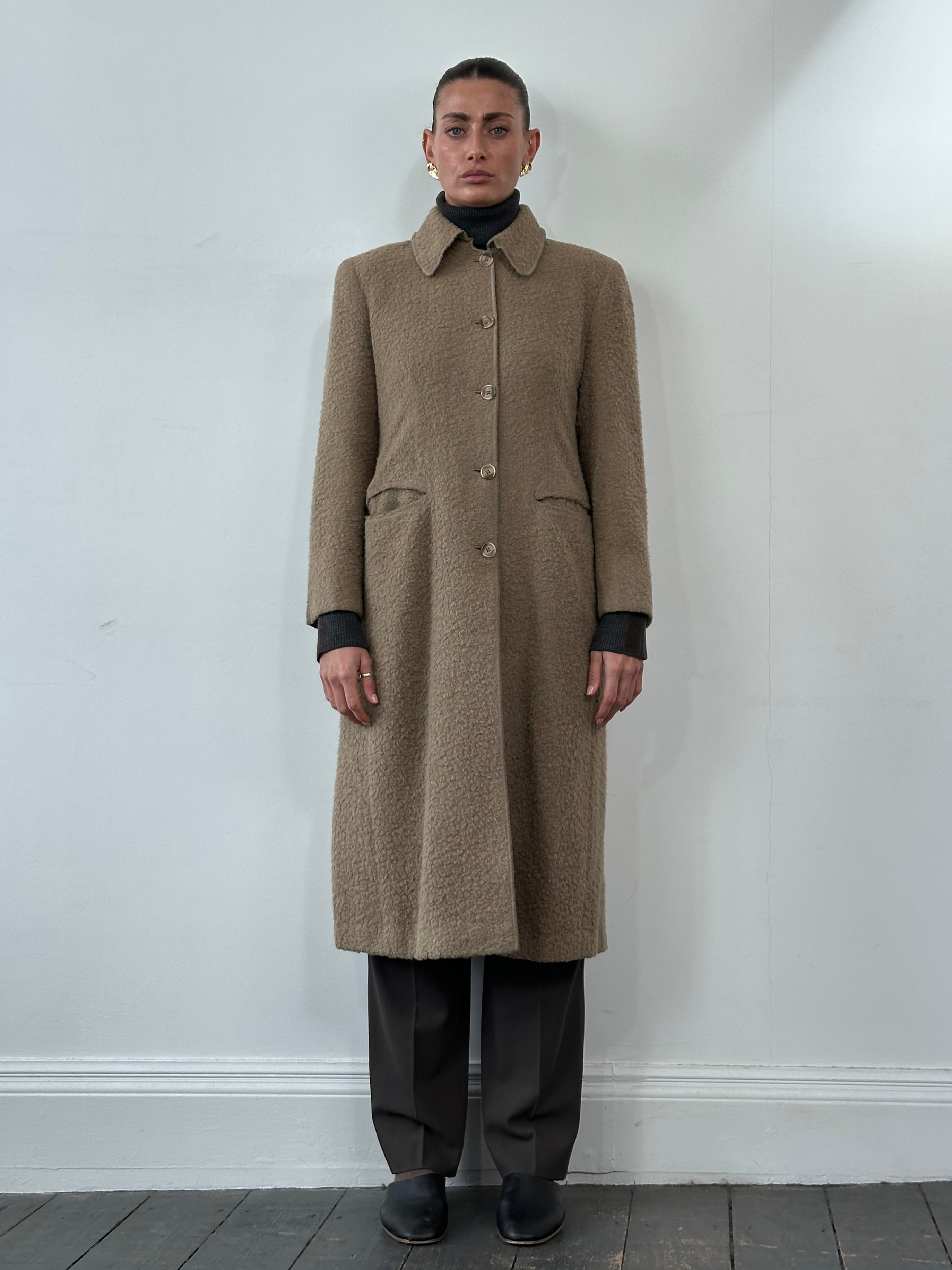 Giorgio Armani 1990s wool single-breasted coat in size M, shown in classic tailored design with lapels and button closure.