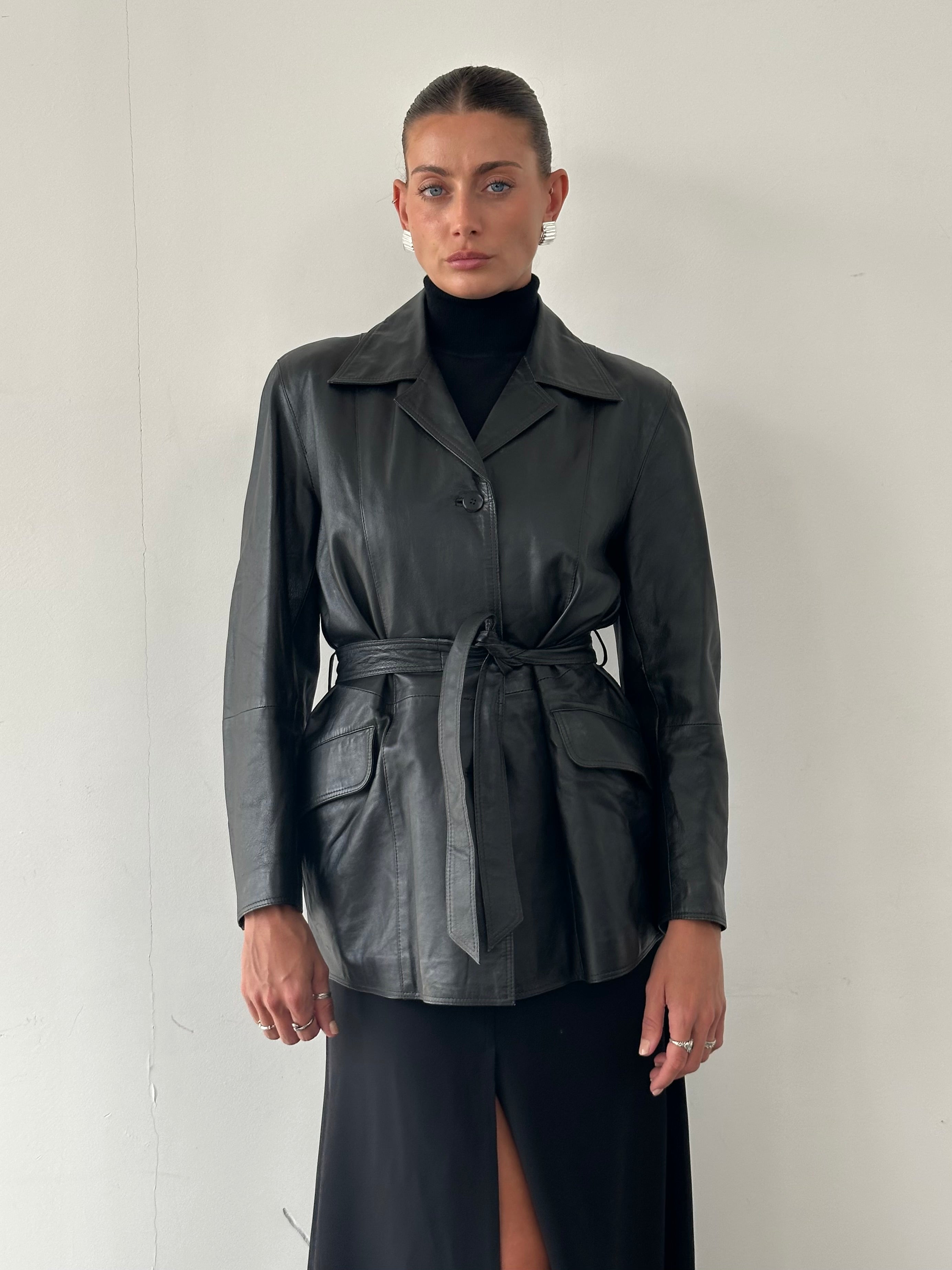 Conbipel belted leather jacket in size M, featuring a classic design with a belted waist and smooth leather exterior.