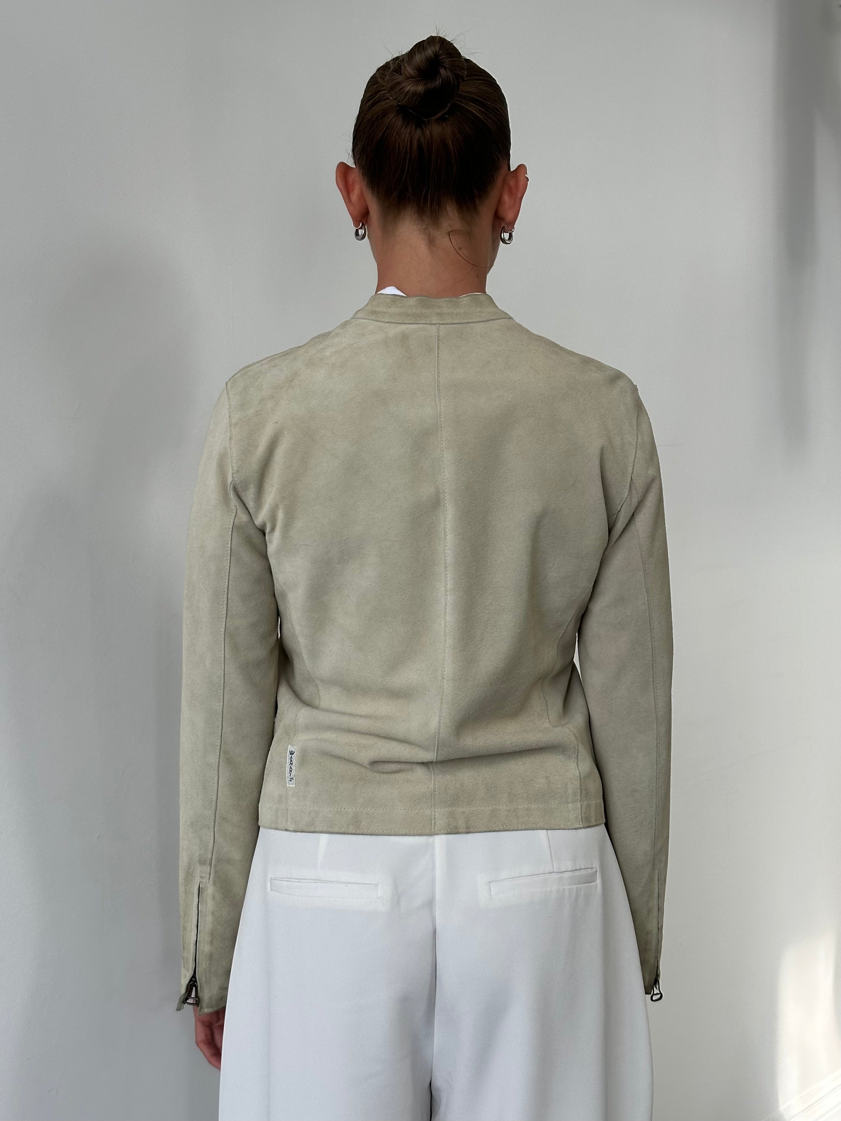 Armani Jeans fitted suede jacket in XS/S, shown in a natural pose, highlighting the soft texture and stylish design.