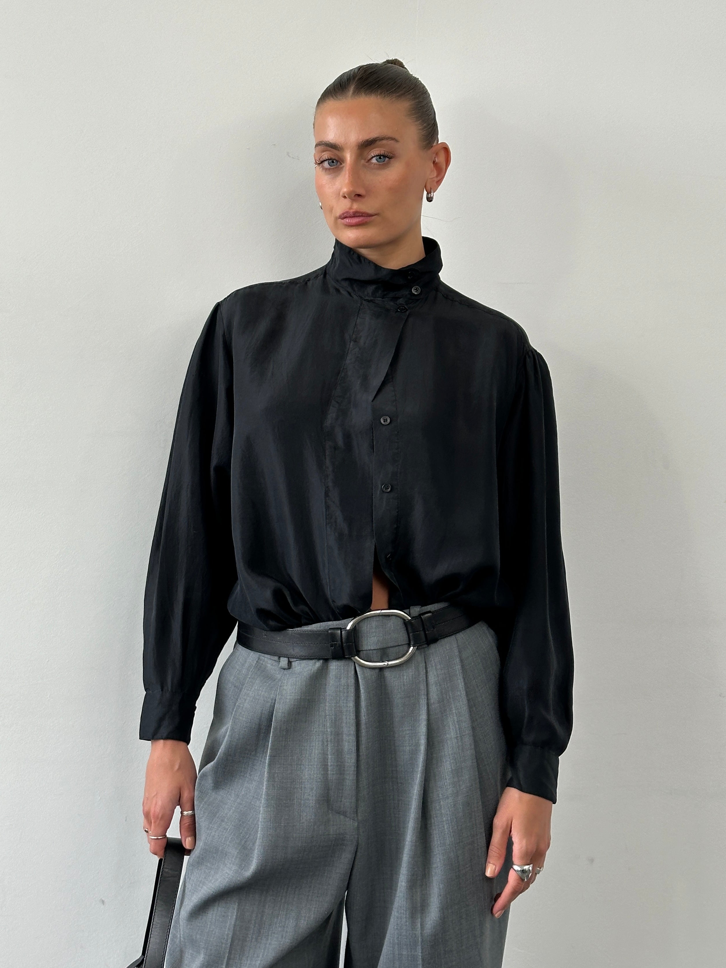 Vintage pure silk high neck shirt in size M, featuring a sleek design and elegant high neckline, displayed on a neutral background.