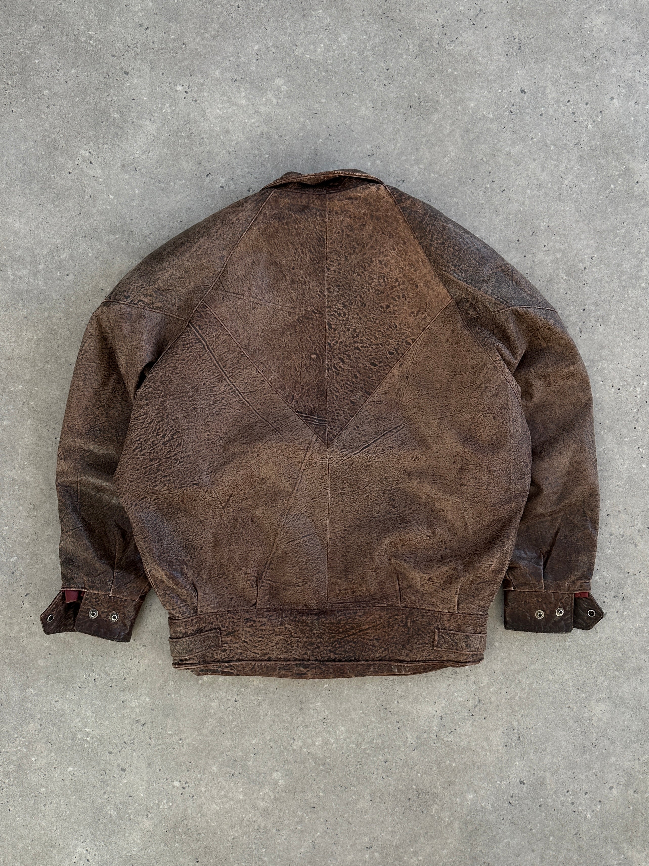 Vintage brand vintage 1980s aged leather jacket in size small, featuring distressed brown leather and classic design.