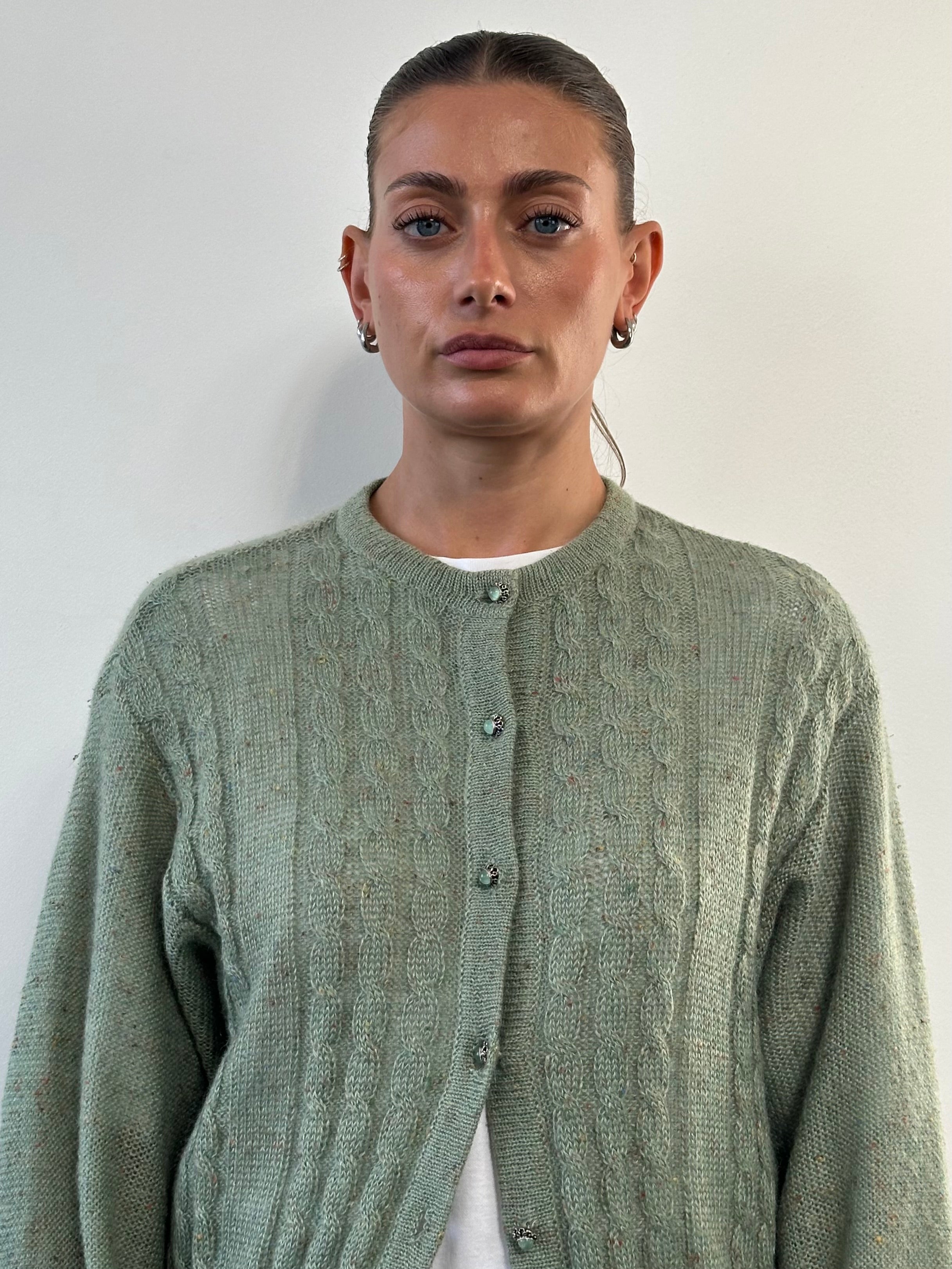 Vintage wool mohair speckle cardigan in size L, featuring a cozy knit with colorful speckle details and classic button closure.