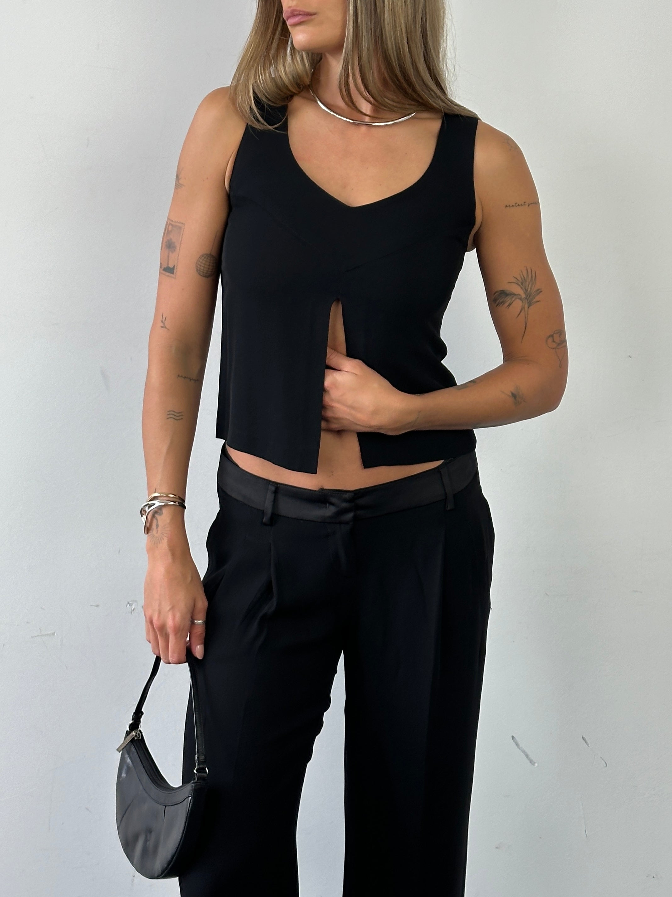 Emporio Armani XS tank top with a split front design, featuring sleek fabric and stylish detail, perfect for casual wear.