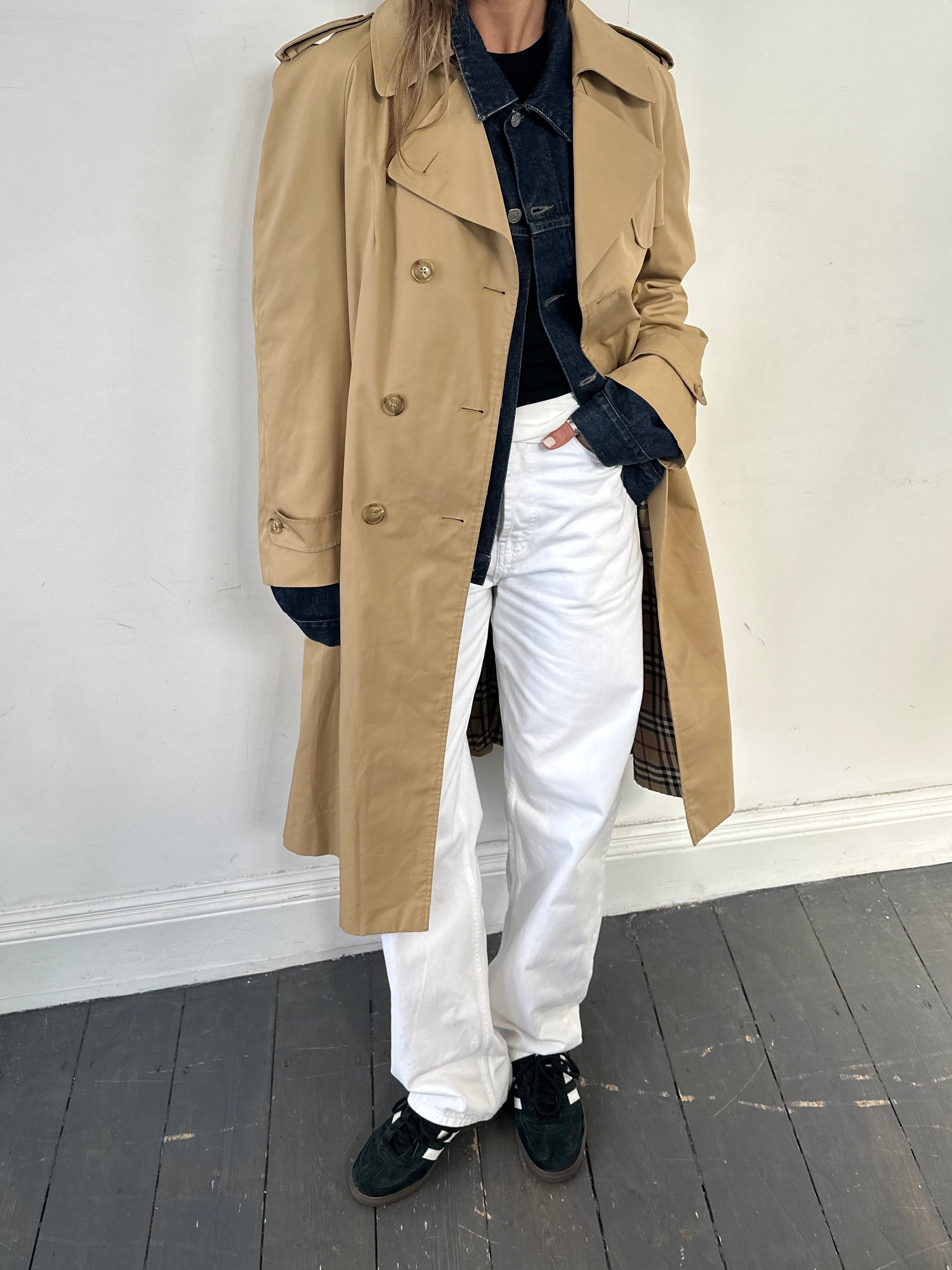 Vintage cotton double-breasted belted trench coat in size L, featuring classic design and timeless style.