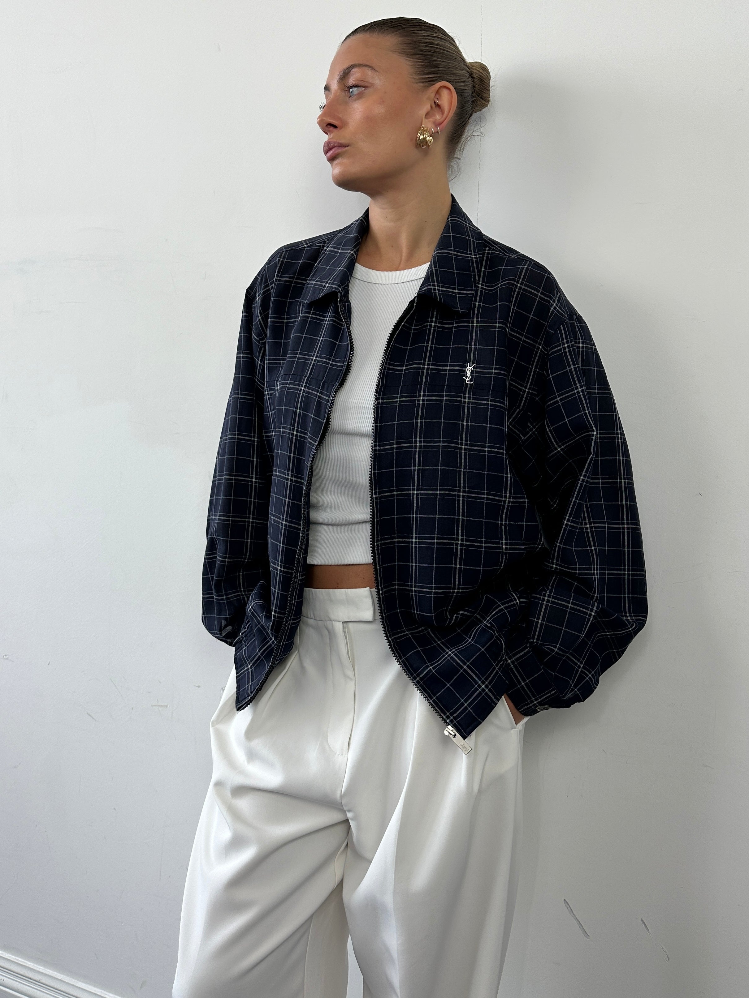 Yves Saint Laurent Pour Homme check logo bomber jacket in size L, black with signature YSL branding and checkered pattern.