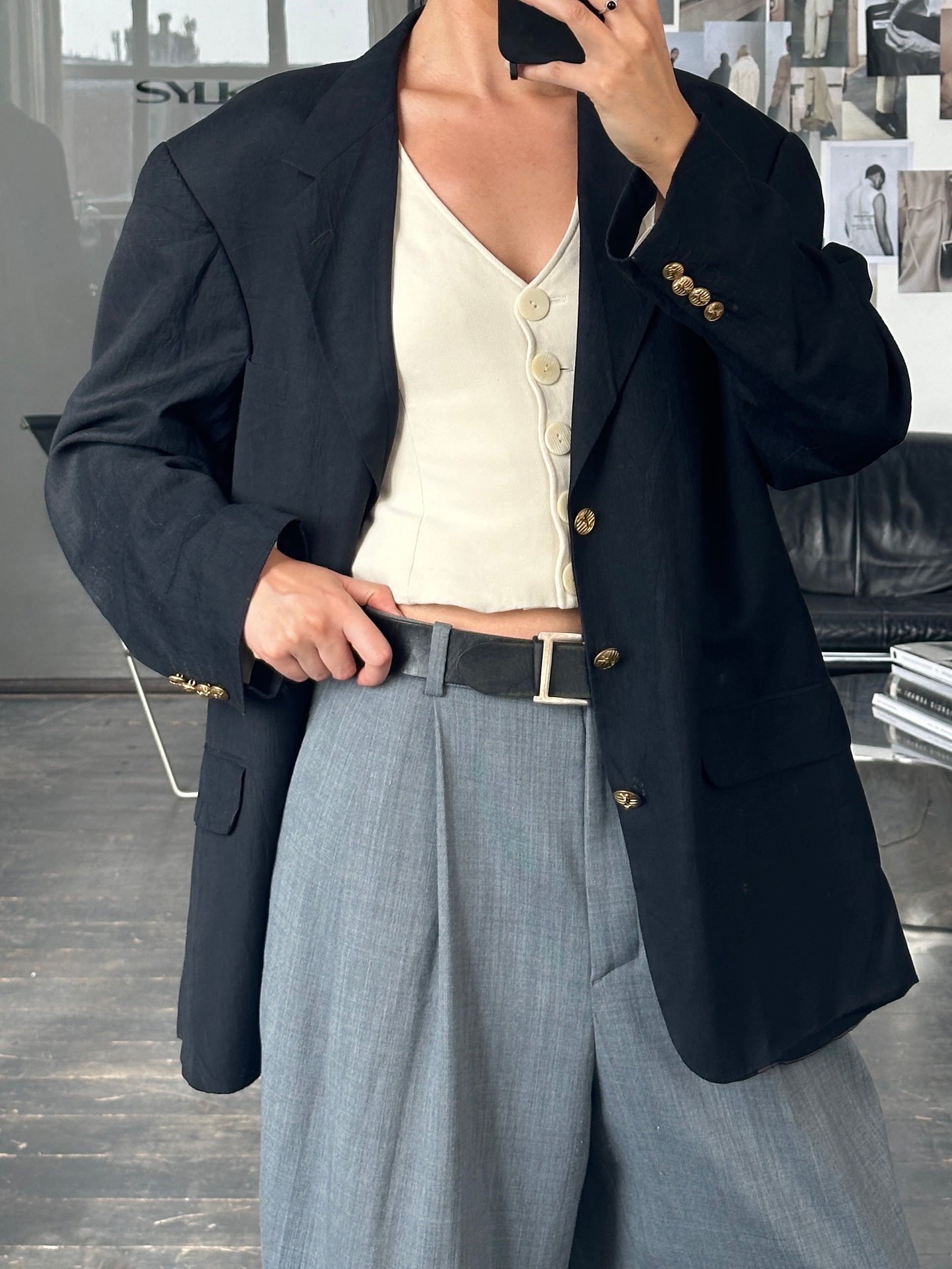 Yves Saint Laurent 1990s bespoke button blazer in size 44R/XL, featuring classic tailored design and elegant dark fabric.