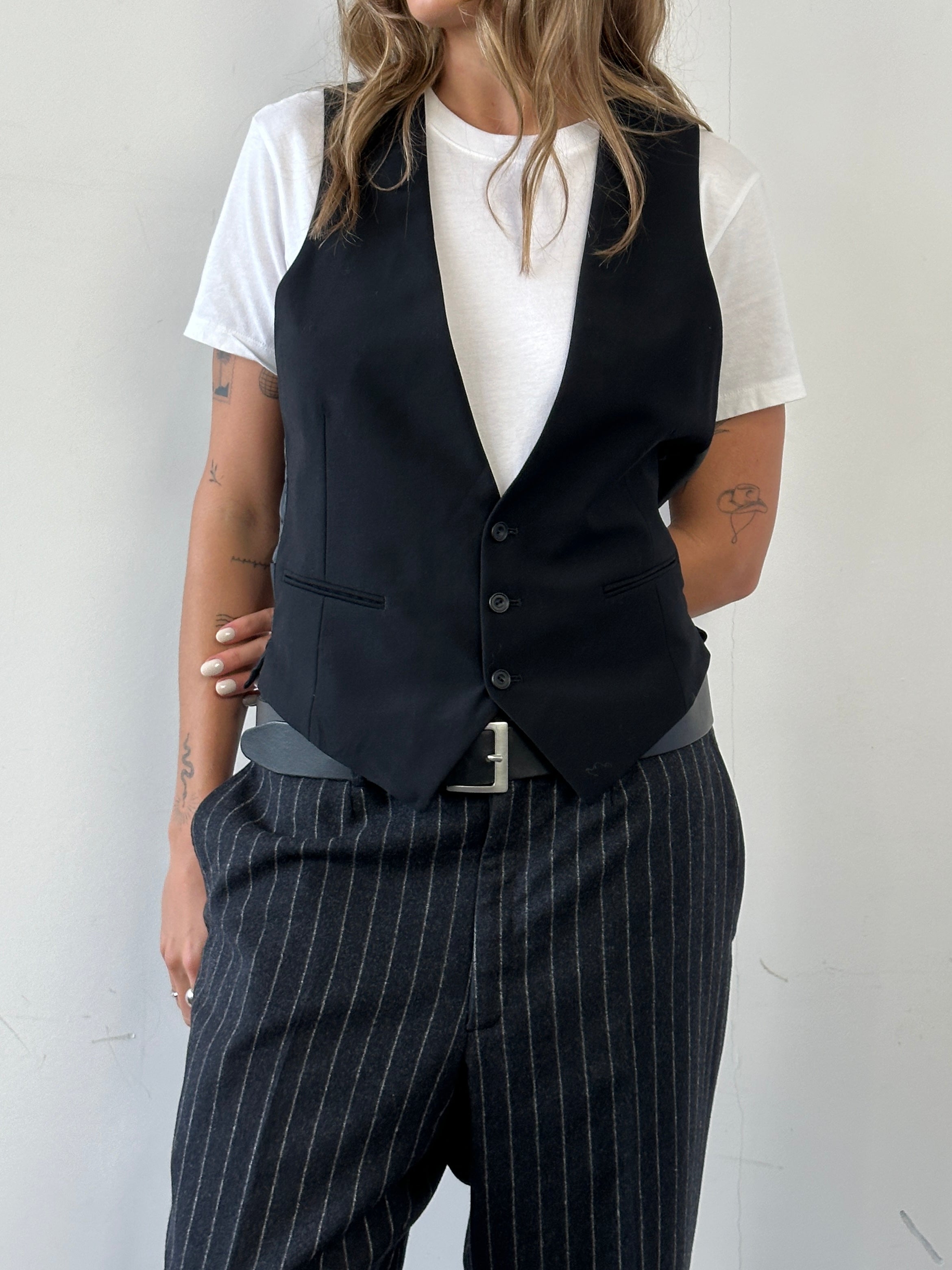Christian Dior wool tailored waistcoat in size M, close-up view showing the elegant fabric and classic design.