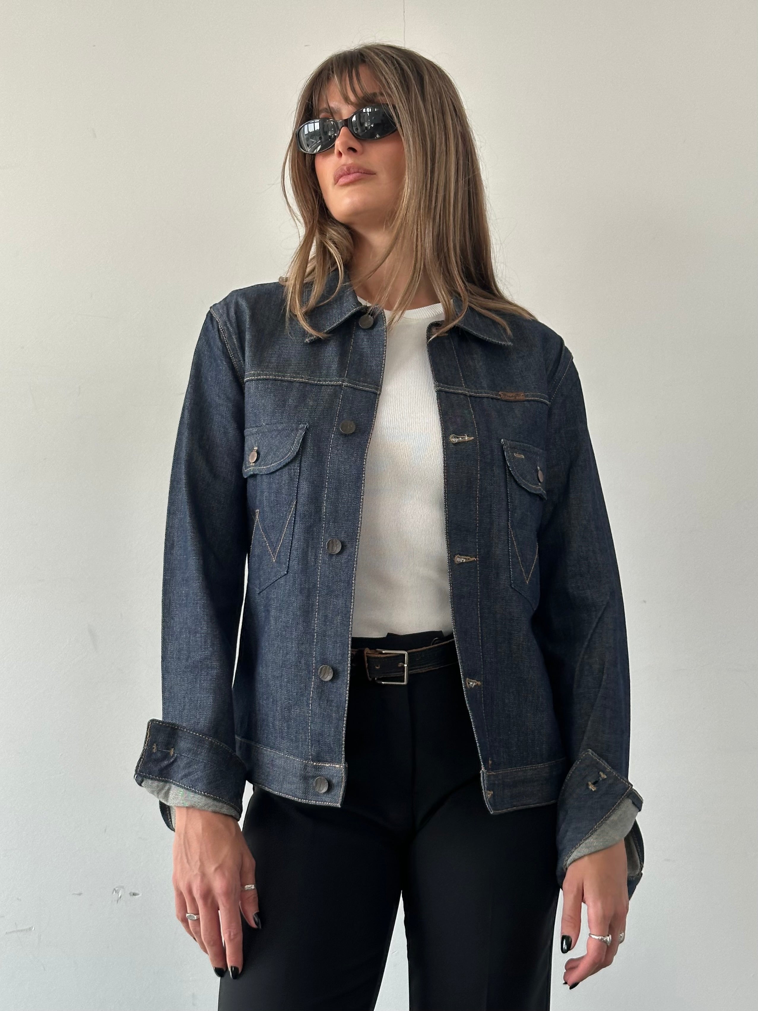 Wrangler organic cotton denim jacket in size S/M, showing classic blue denim with button closure and chest pockets.