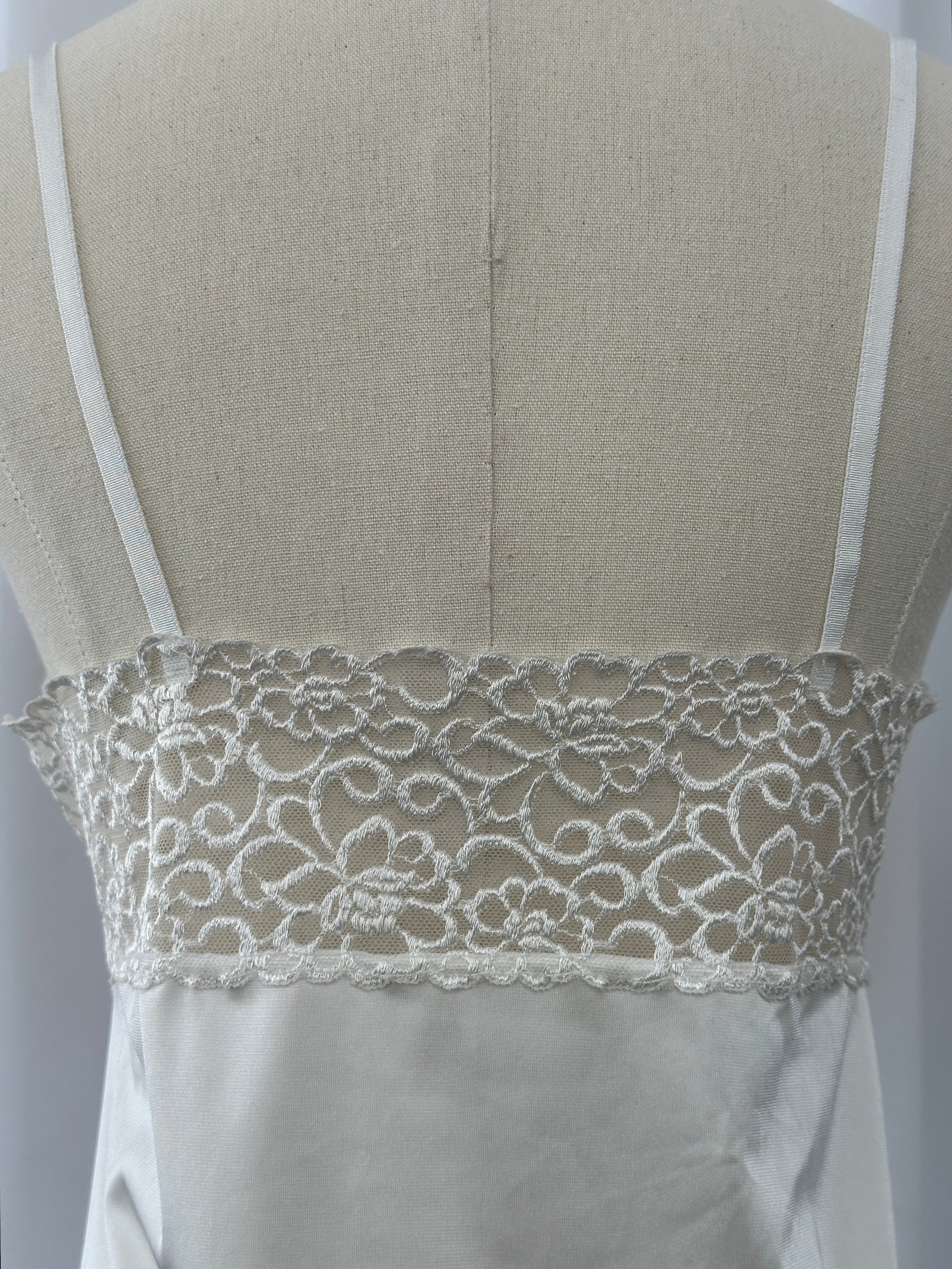Japanese vintage 1990s lace sheer mini slip dress, size small, with delicate floral lace details and a lightweight, flowy silhouette.