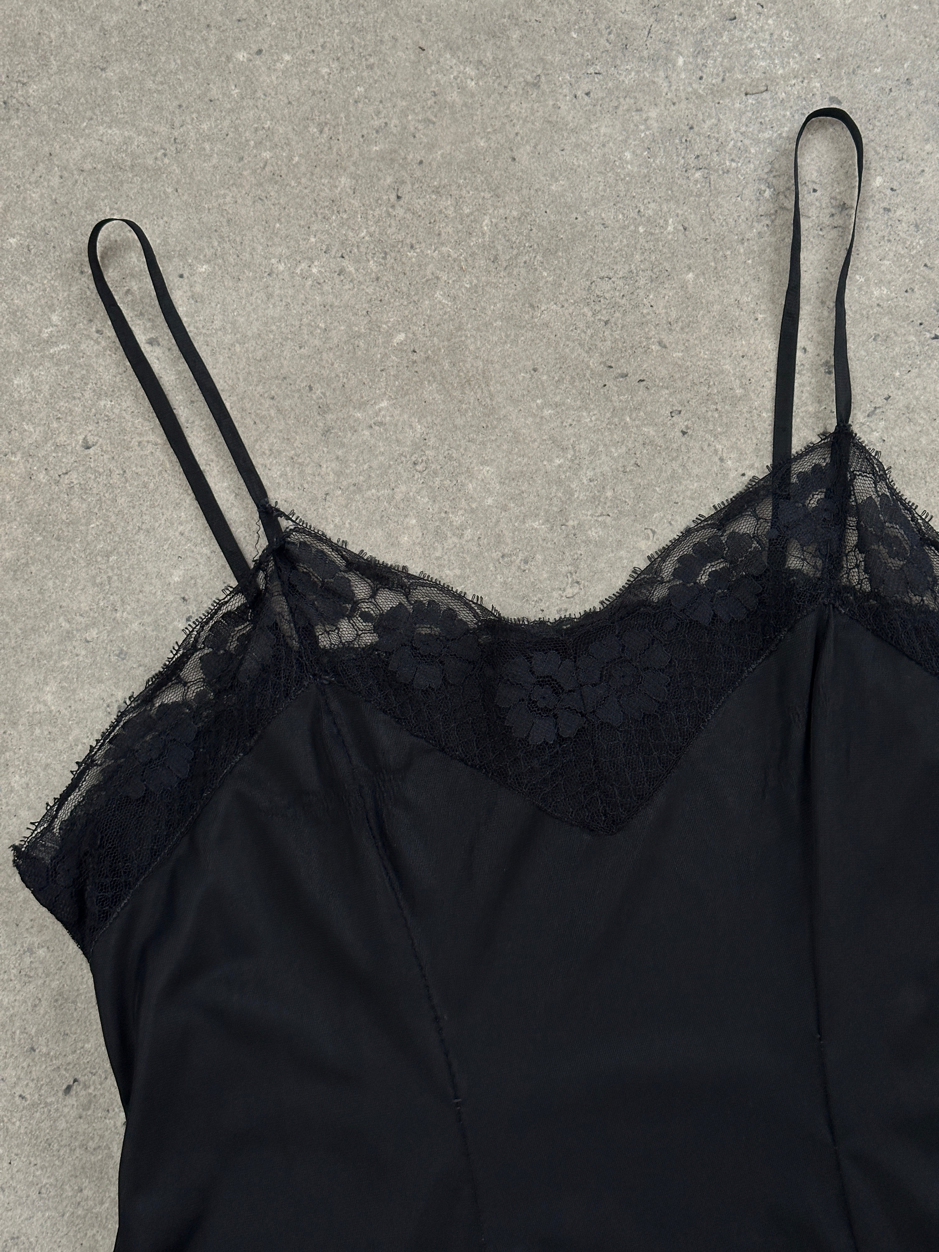 Vintage 1980s lace semi-sheer slip dress in size M, featuring delicate lace fabric and vintage-inspired design.
