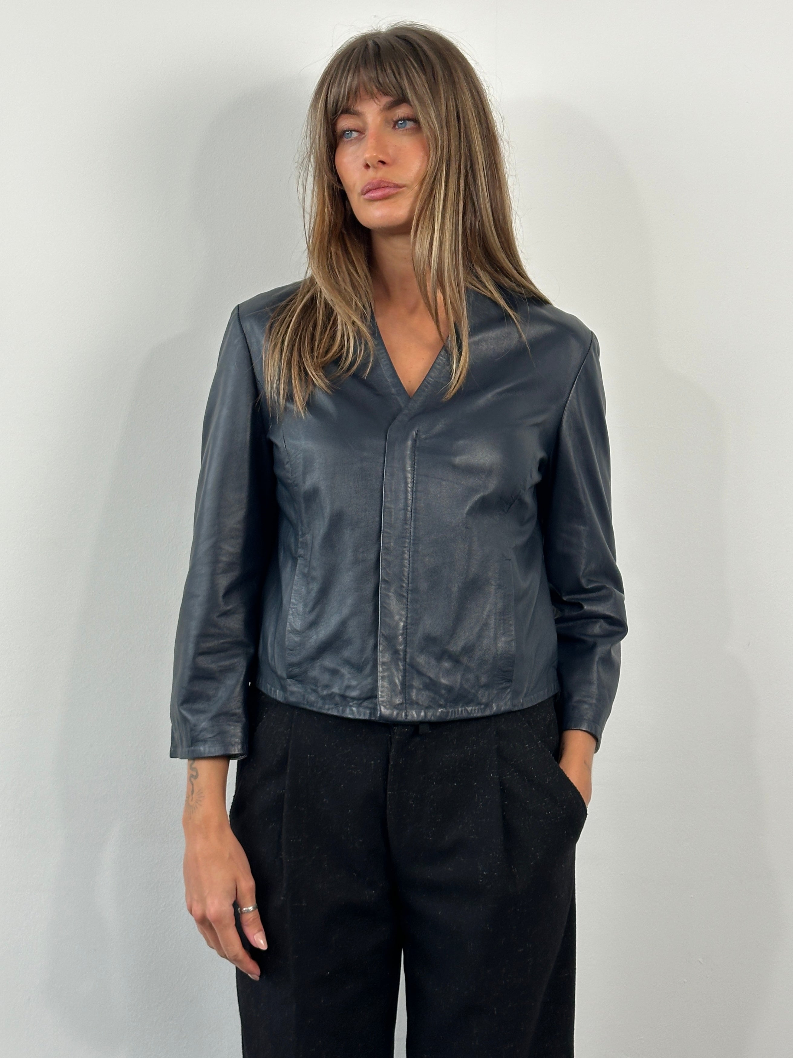 Armani Jeans 2000s lamb leather jacket in size S, black with sleek design and classic collar, displayed on a hanger.