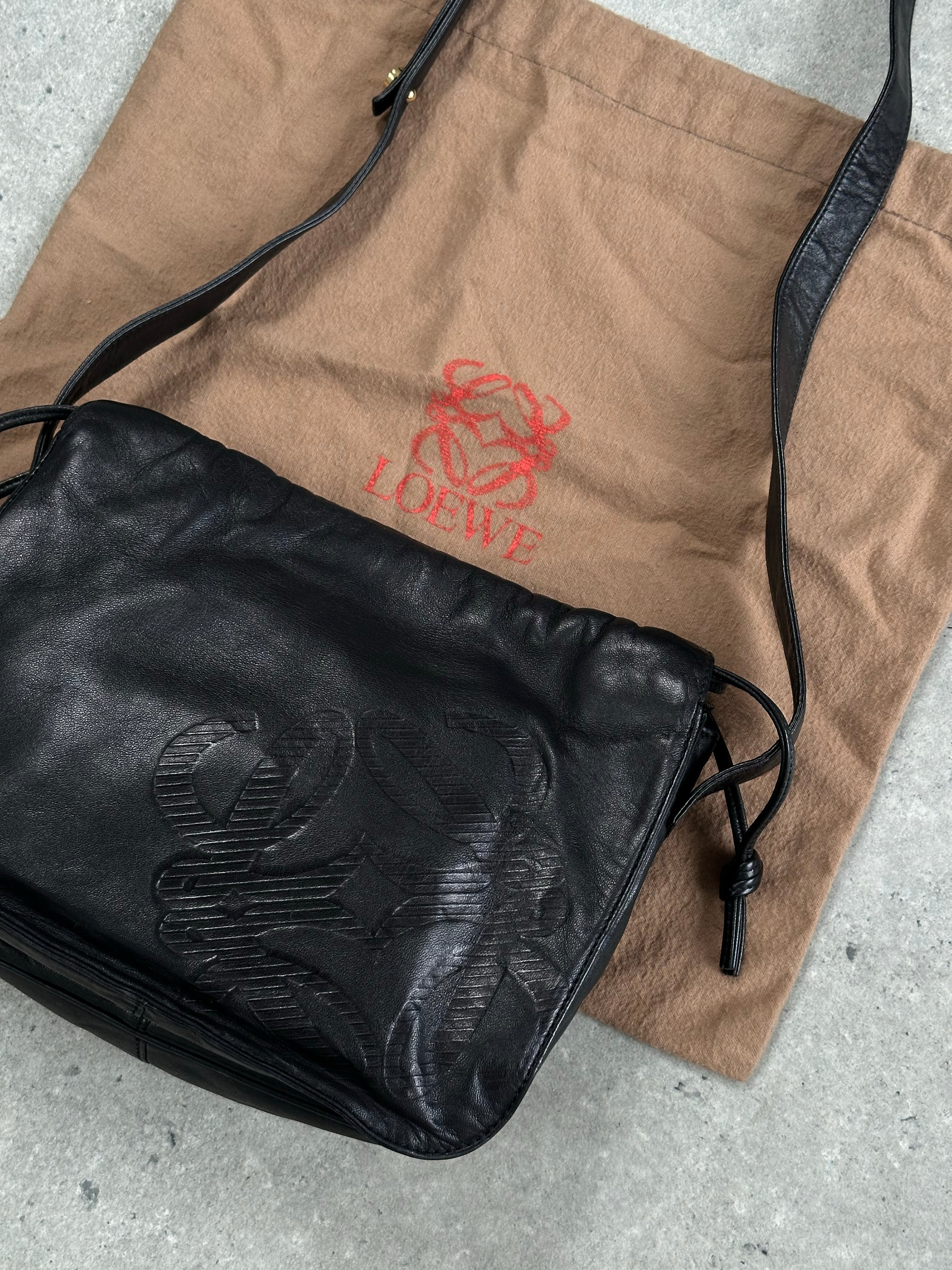 Loewe 1990s ruched leather Anagram crossbody bag with adjustable strap and signature logo detail, in earthy brown tones.
