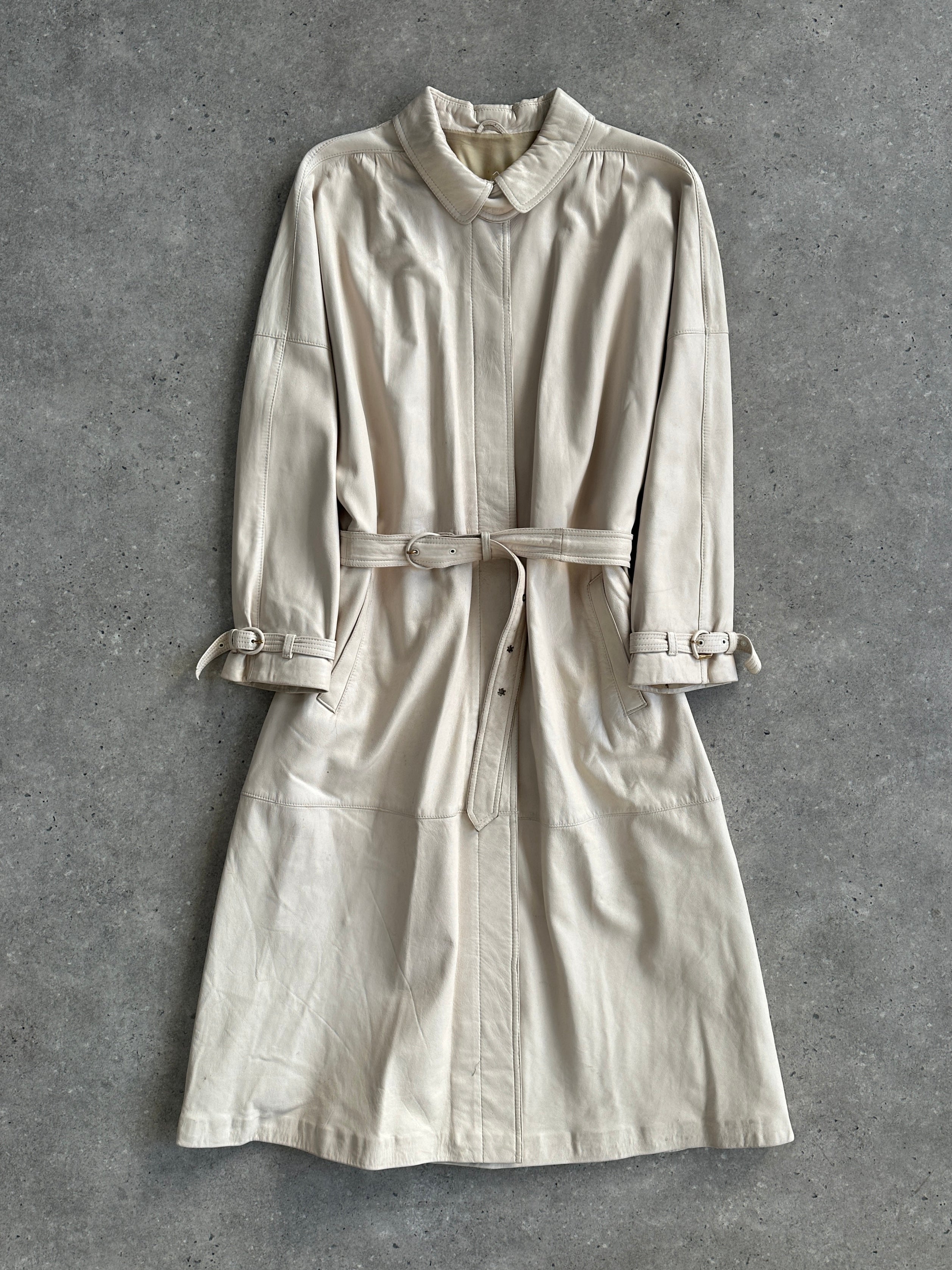 Vintage belted leather trench coat in classic style, featuring a leather jacket design with a belt and vintage-inspired details.