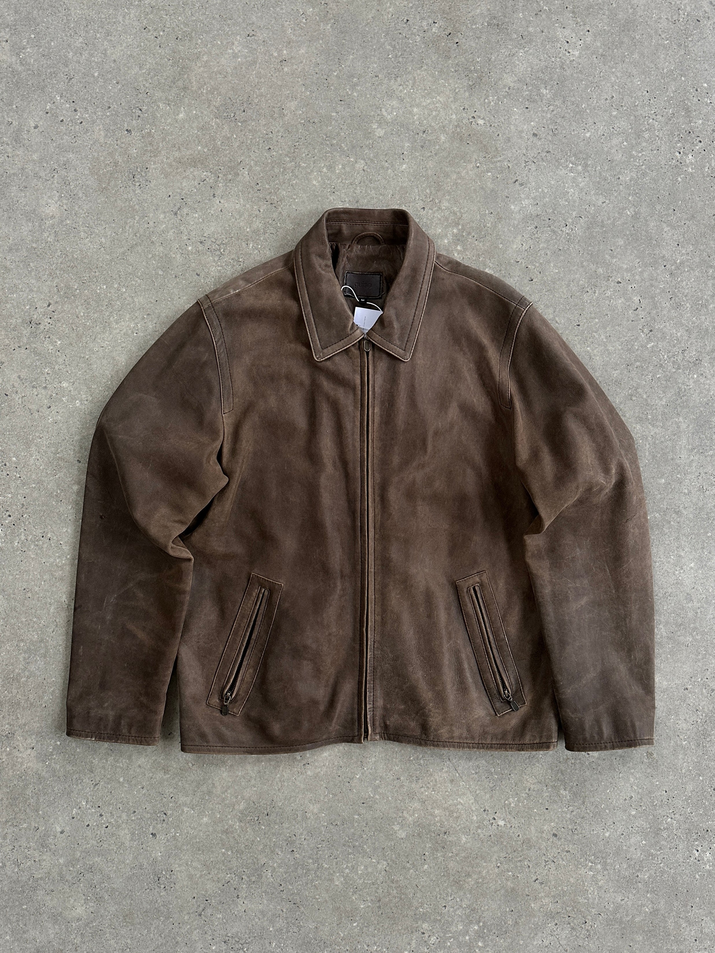 Vintage distressed leather jacket in size L, featuring a rugged look with worn leather and classic design details.