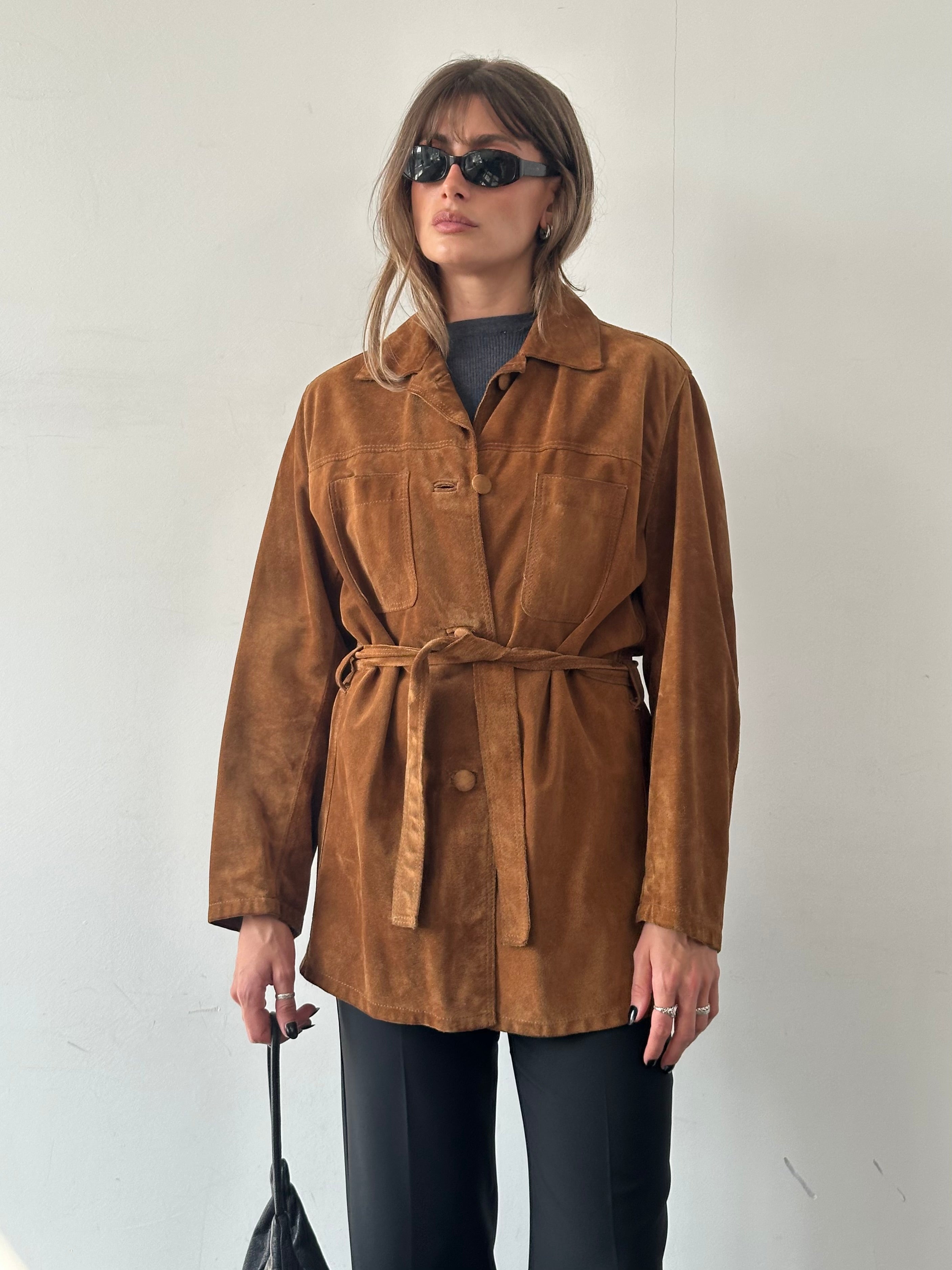 Vintage Italian belted suede jacket in size M/L, featuring classic design and textured leather, displayed on a neutral background.