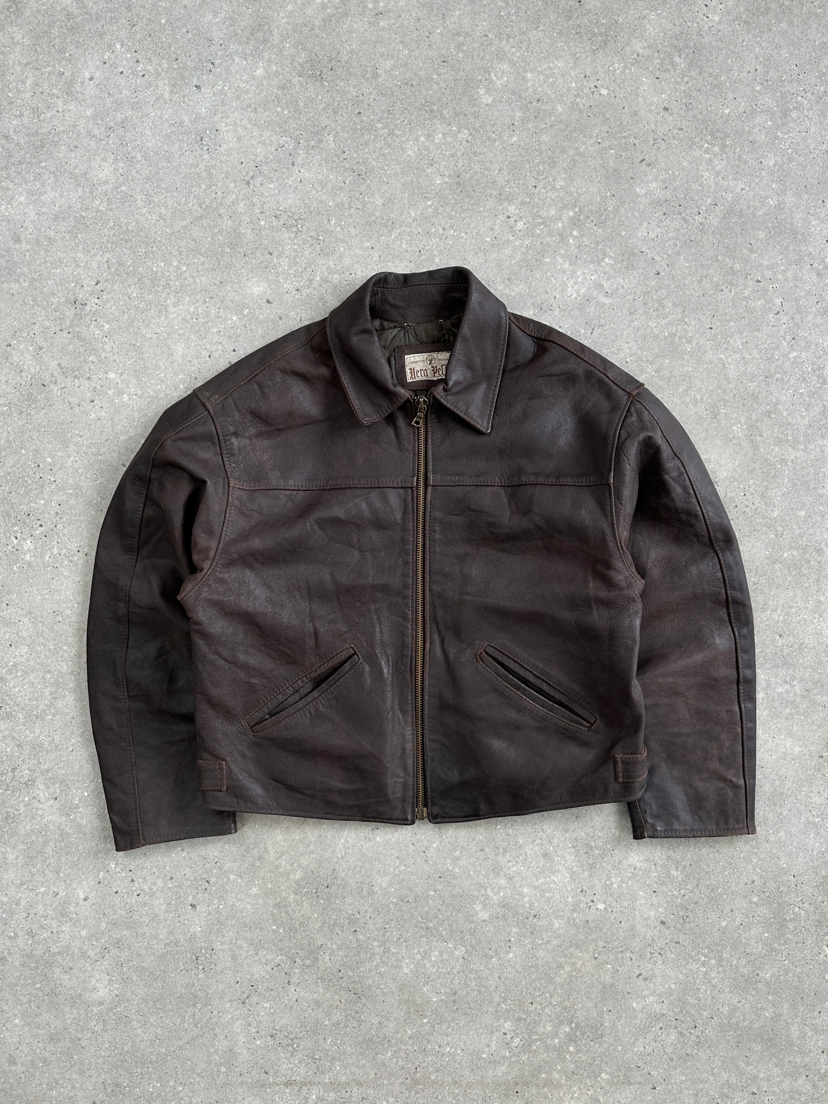 Vintage 1980s cropped leather jacket in size L with classic design, featuring a rugged texture and stylish collar.