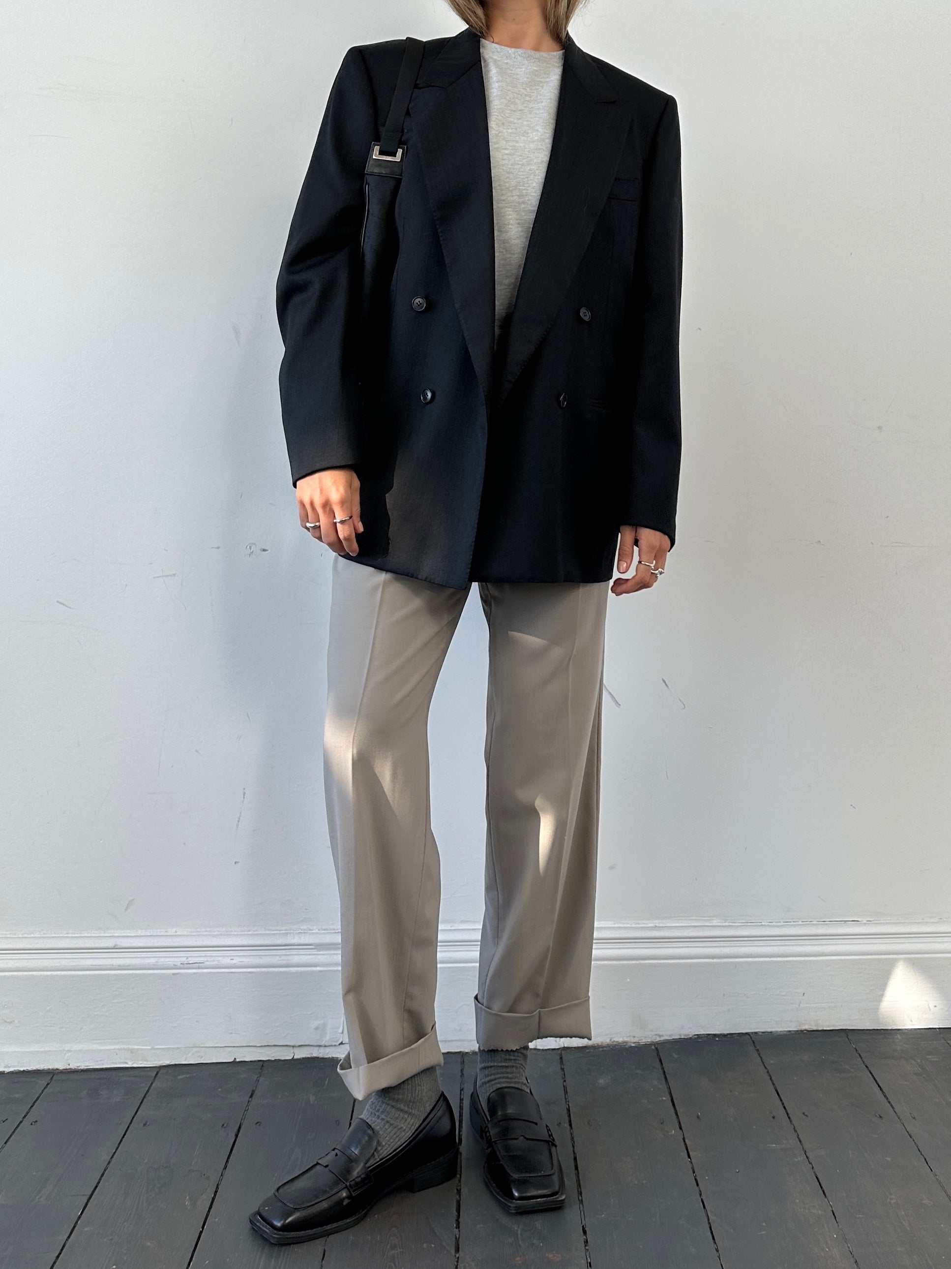 Pal Zileri oversized double-breasted blazer with wide lapel, tailored fit, in a neutral fabric, front view showing details.