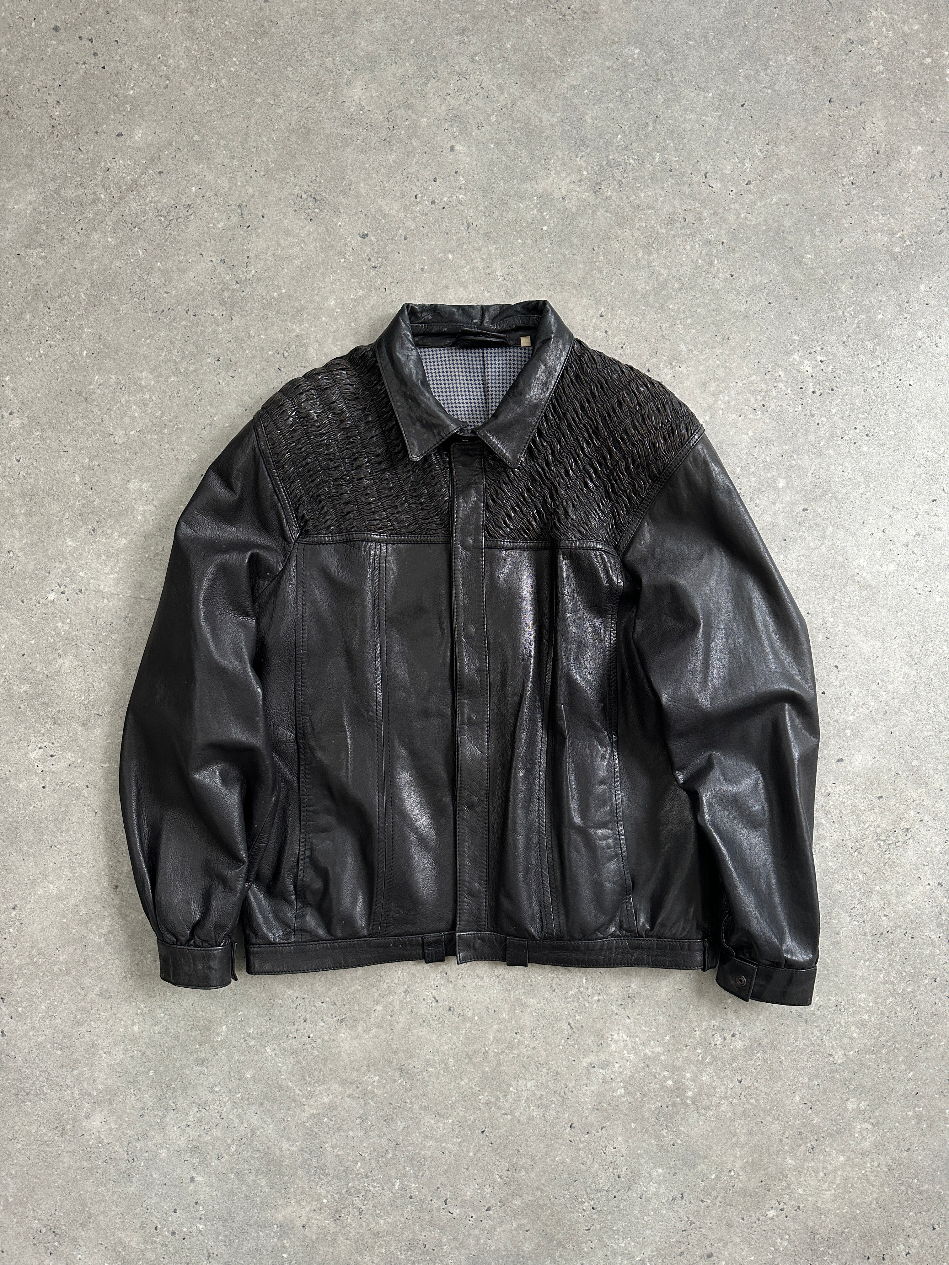 Vintage brand vintage ruched leather jacket in size M, showing the textured leather design and classic collar detail.