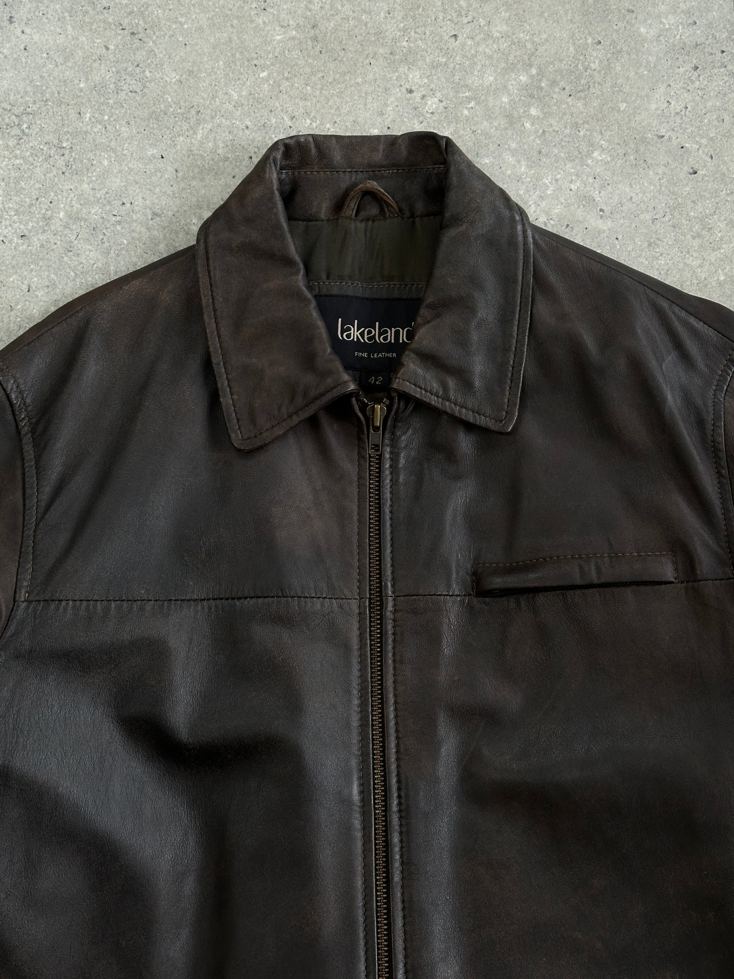 Vintage minimal aged leather jacket in XL size, showcasing distressed brown leather with classic collar and button details.