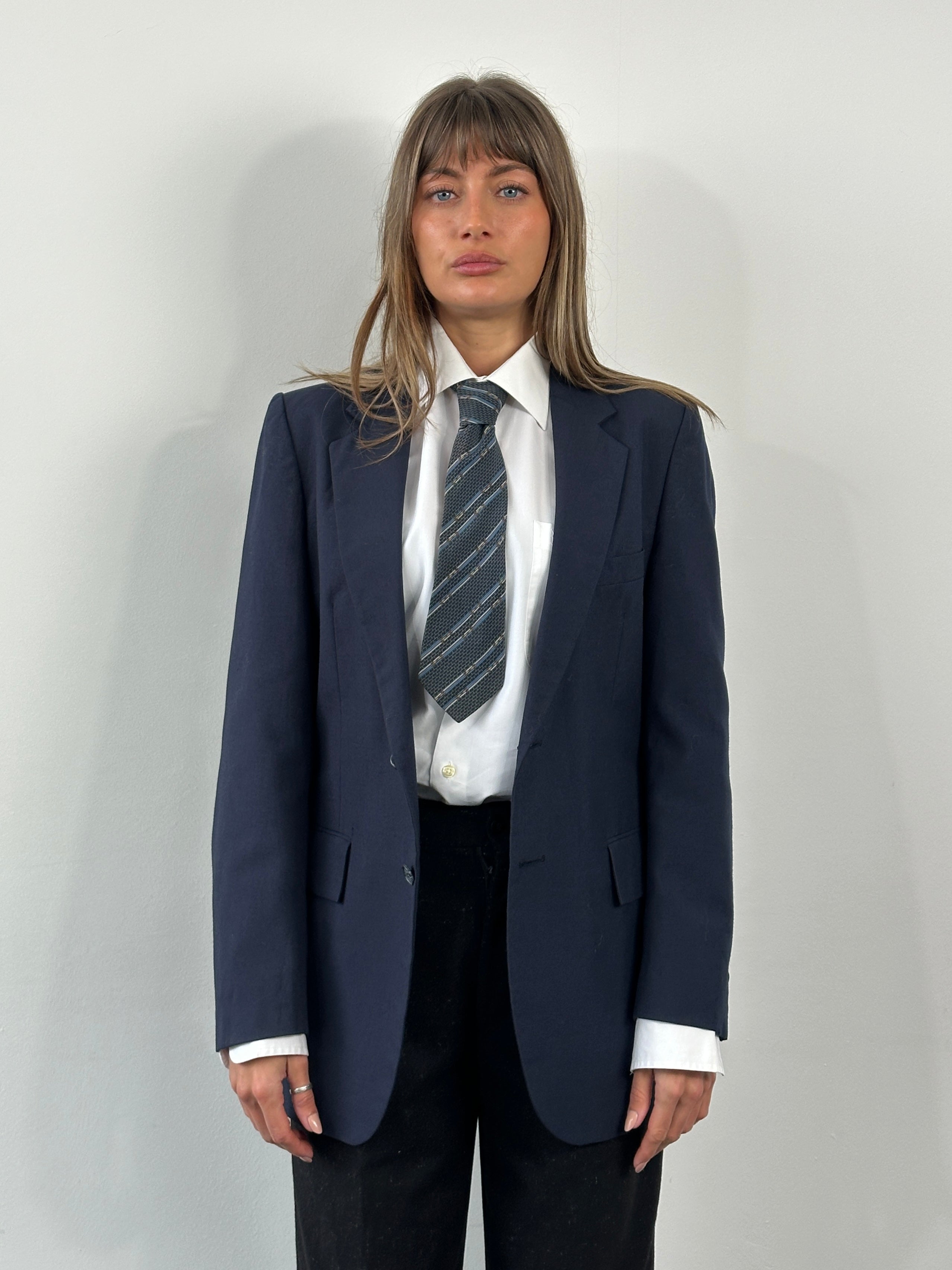 Yves Saint Laurent 1990s pure wool single-breasted blazer in size 36R/S, shown in a classic tailored fit with lapel collar