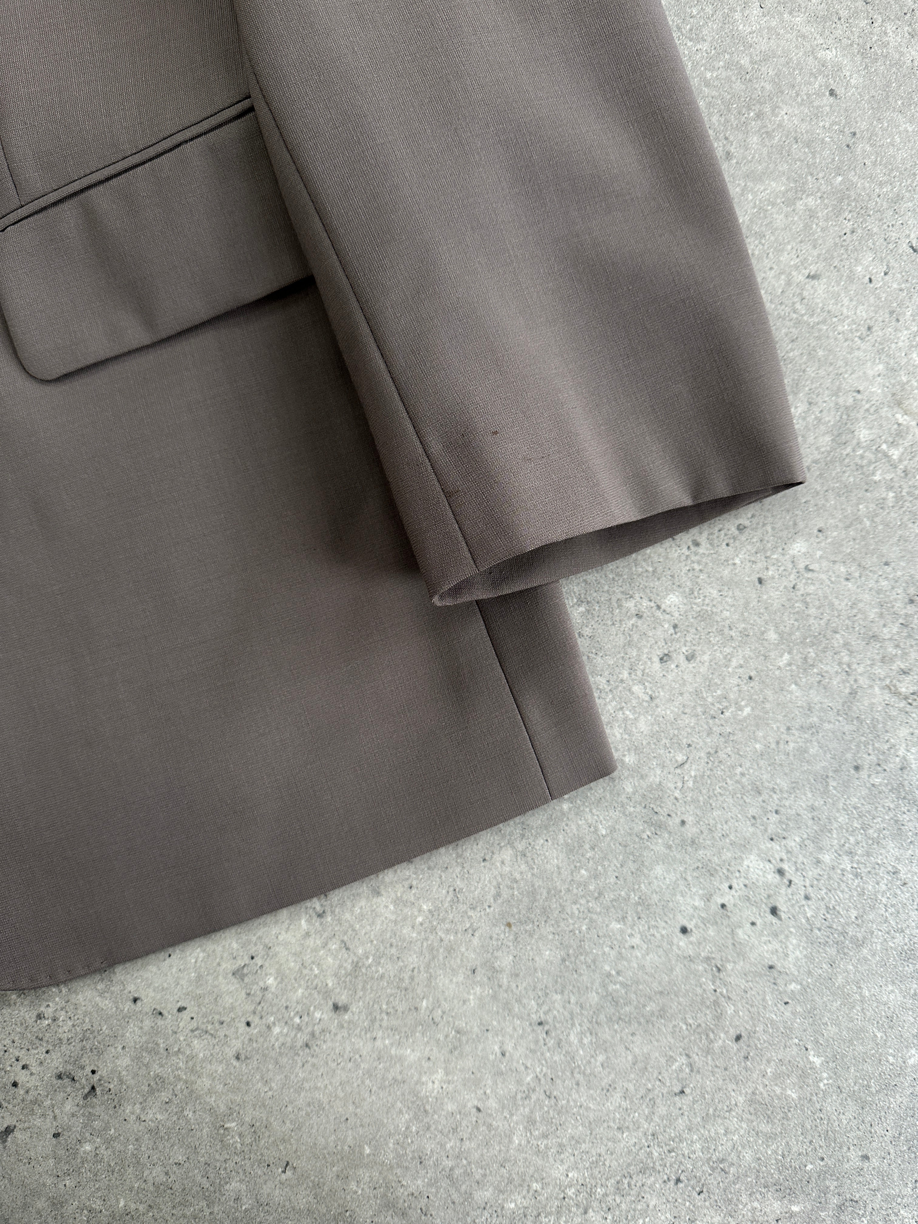 Vintage wool single-breasted jumpsuit in size 42S/W34, featuring a classic tailored fit and vintage style.
