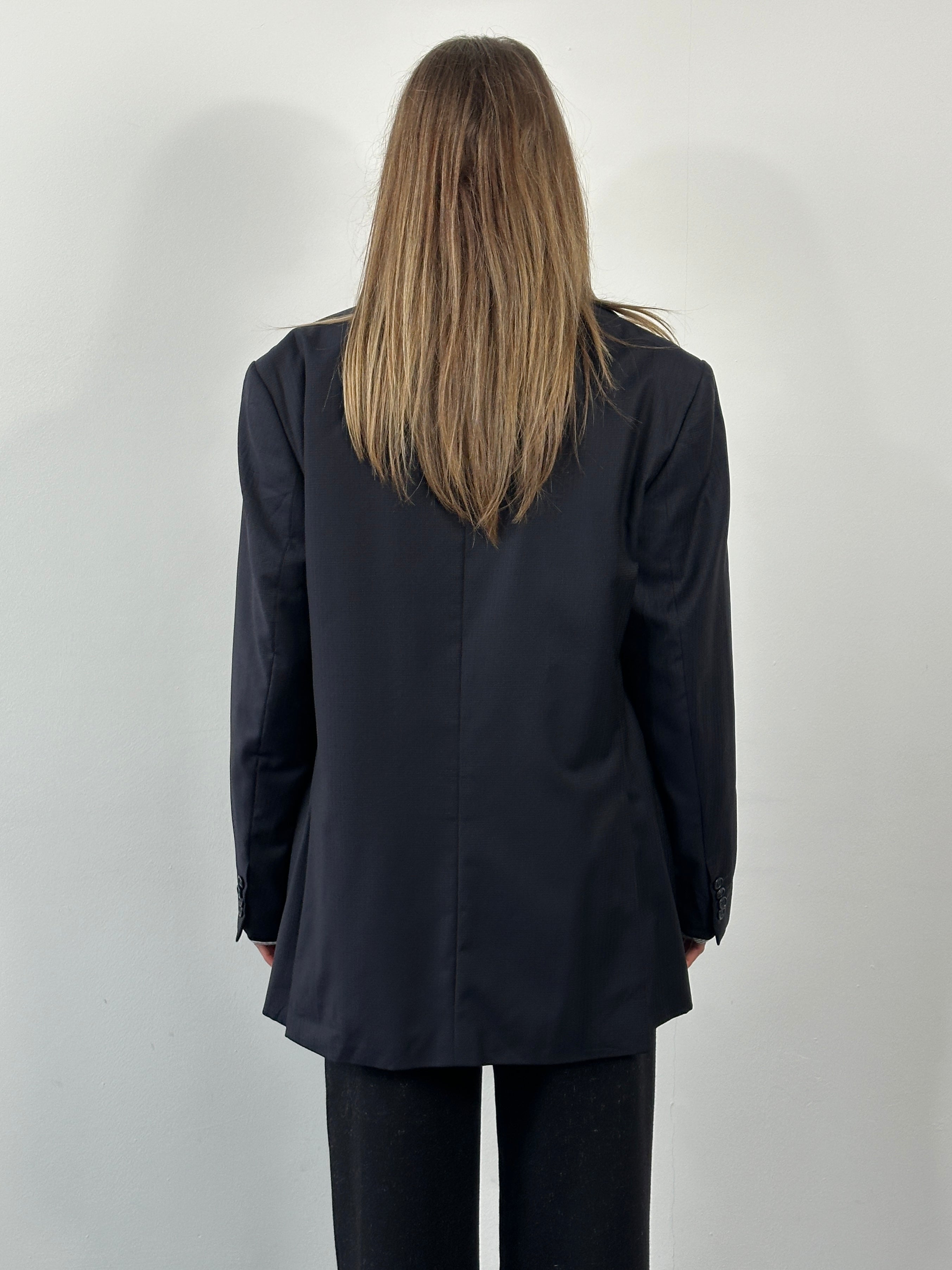 Loro Piana 1990s pure wool single-breasted blazer in size 42R/L, tailored fit with classic lapel and button closure.