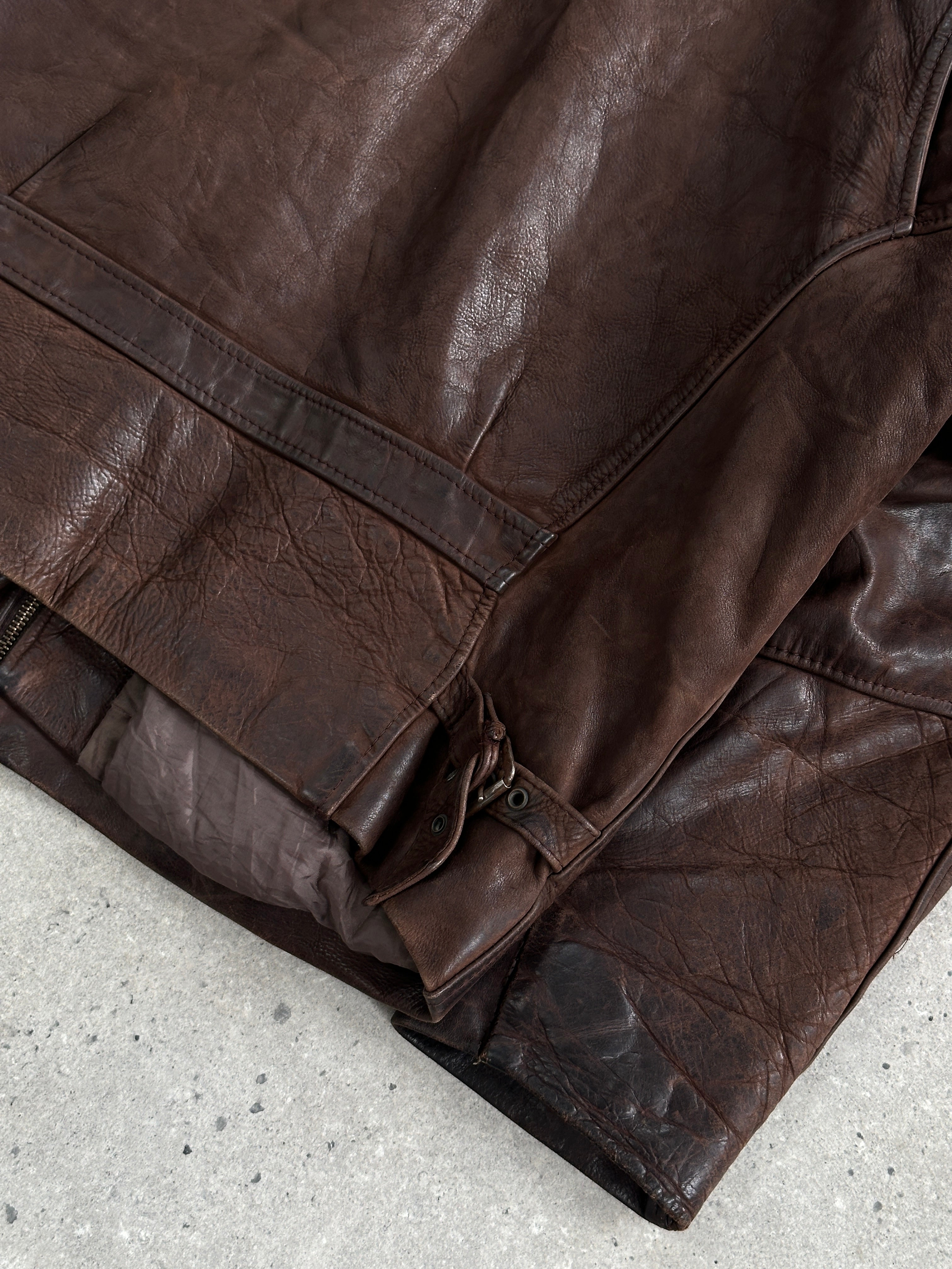 Vintage French 1980s aged boxy leather jacket, size large, with distressed leather and classic vintage style.