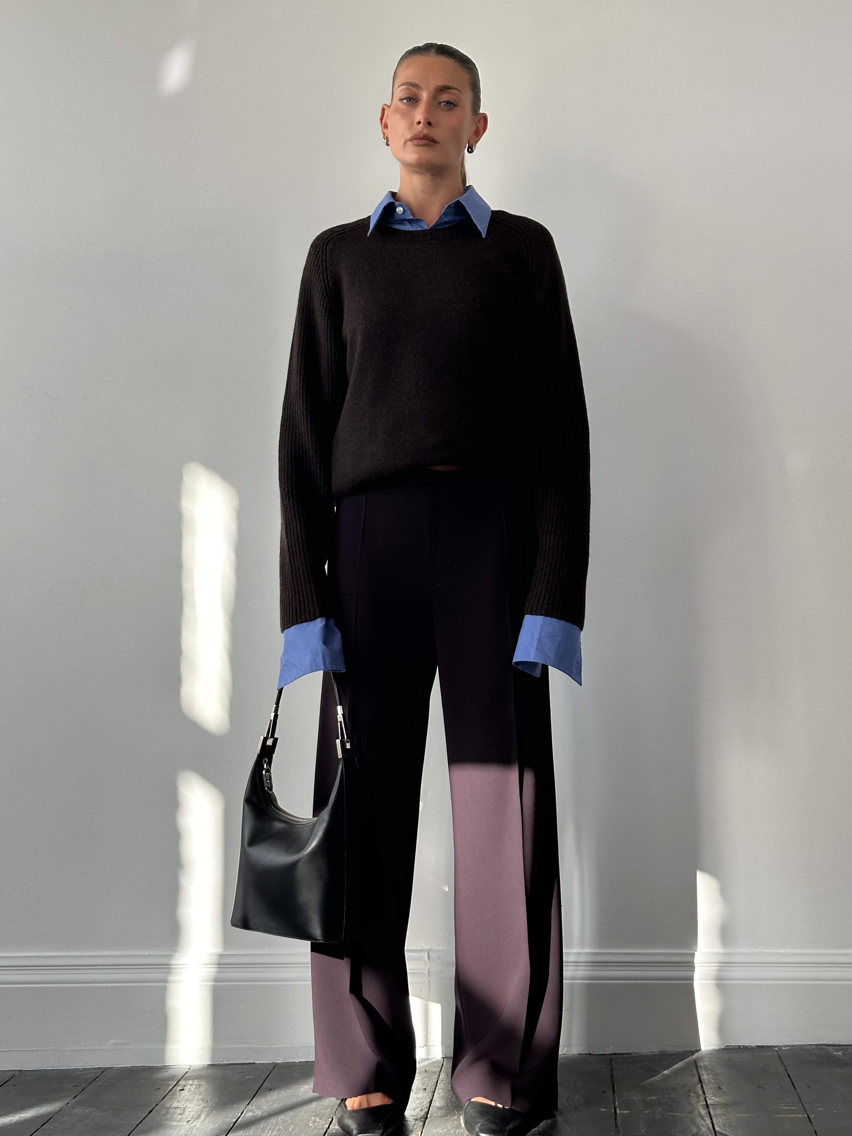 Max Mara minimal wide-leg trousers in W32, shown in a neutral fabric with a high waist and flowing wide-leg design.