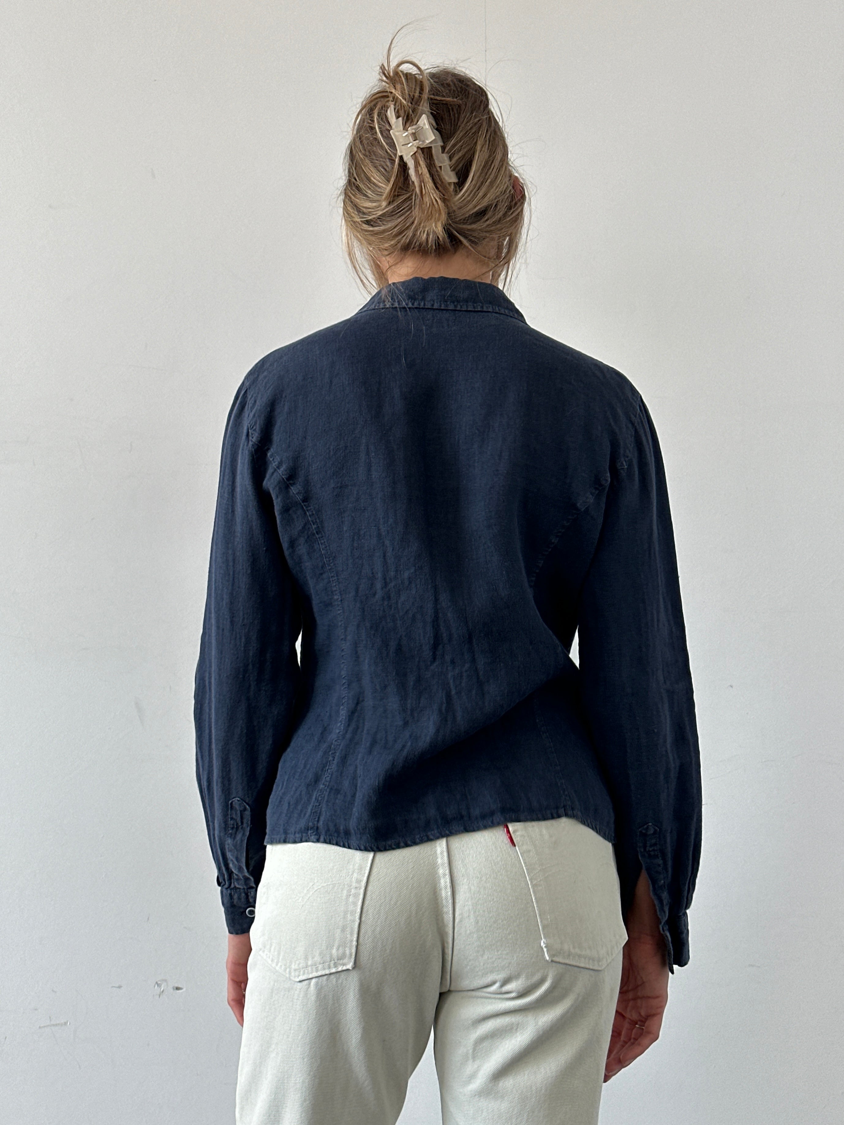 Armani Jeans pure linen fitted shirt in light fabric, shown on a hanger with a classic collar and long sleeves.