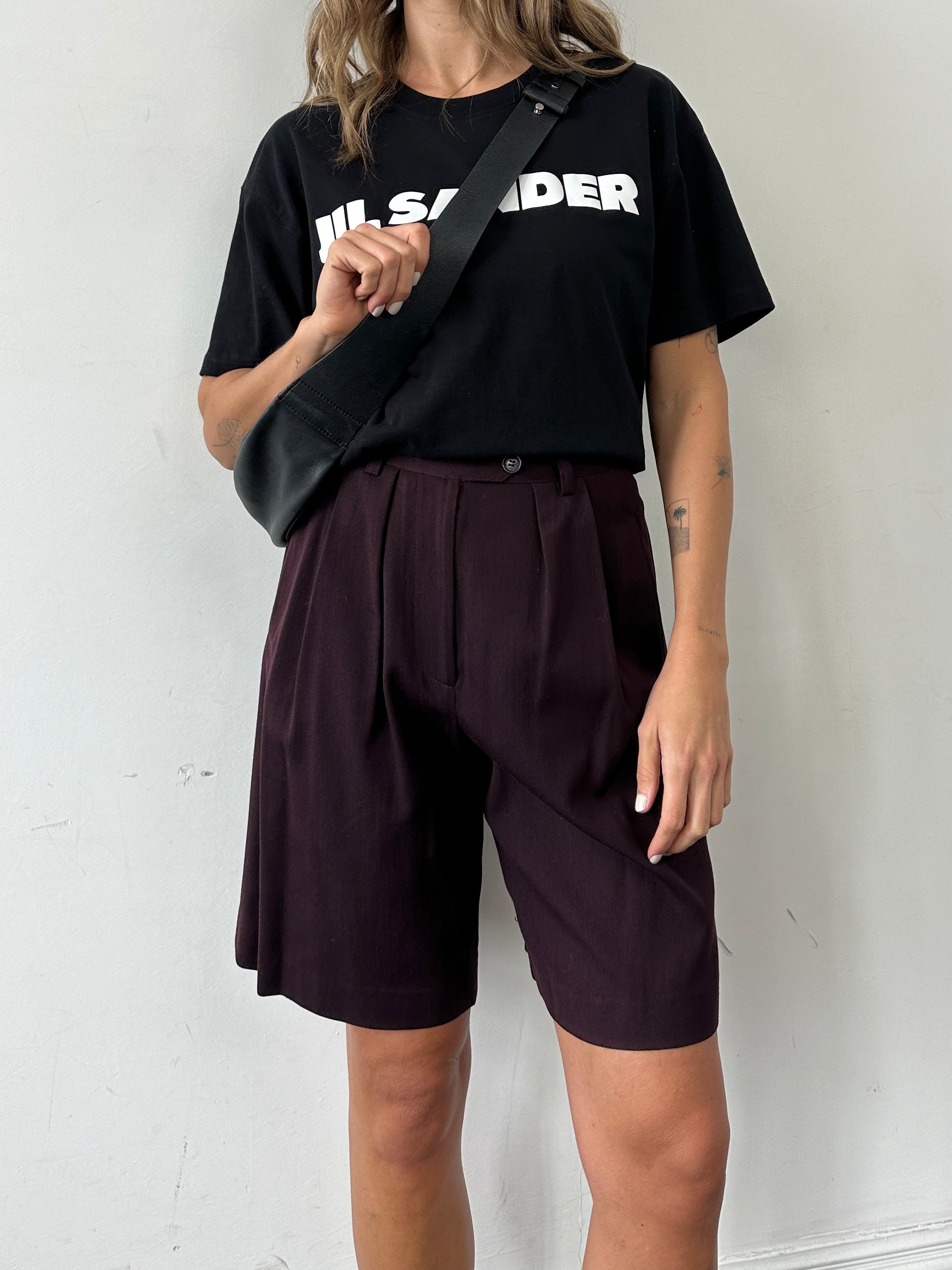 Emporio Armani wool high-waisted tailored shorts in dark fabric, front view showcasing sleek, structured design.