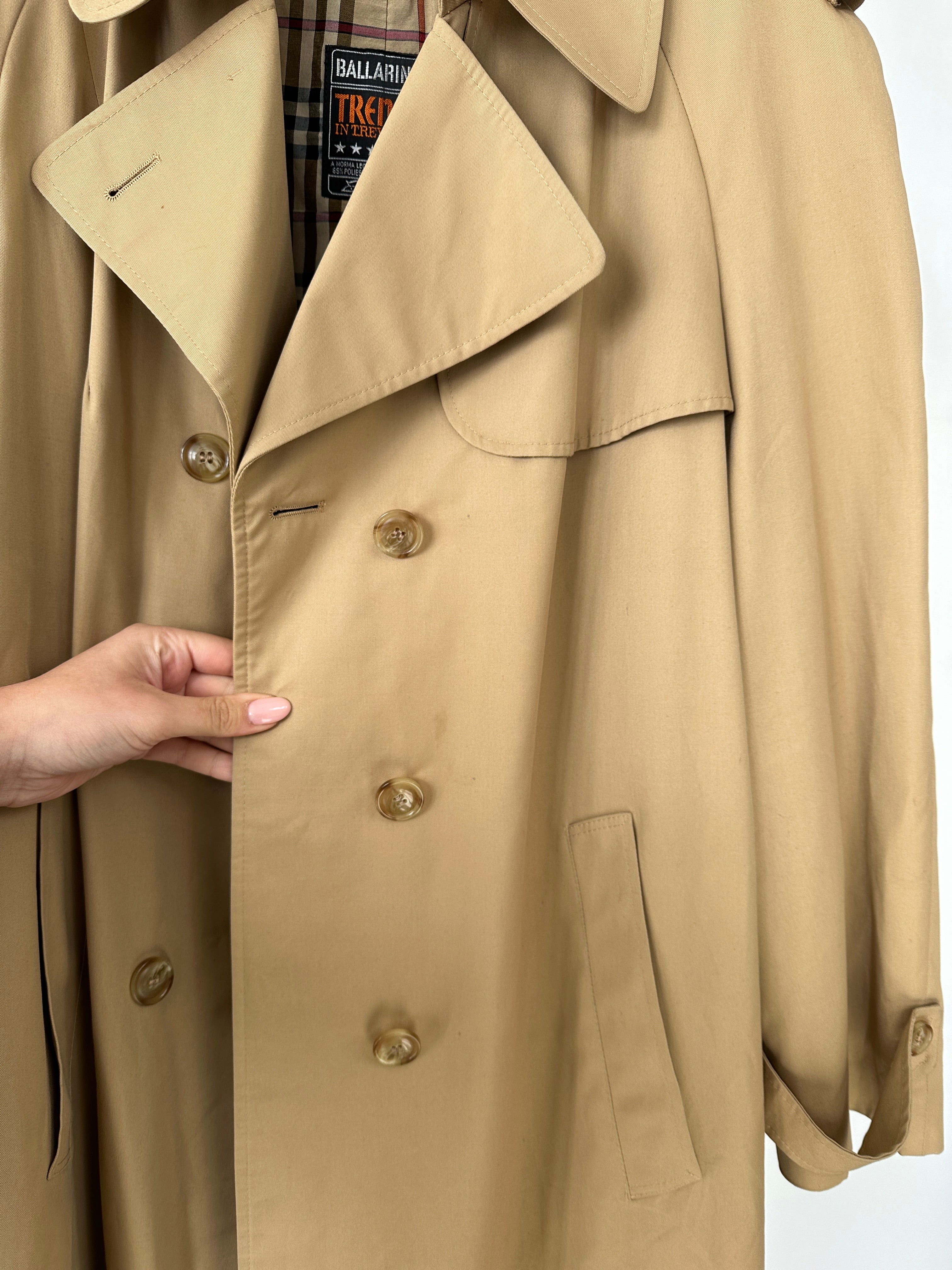 Vintage brand vintage cotton double-breasted belted trench coat in size L, shown on a hanger with classic style and beige color.