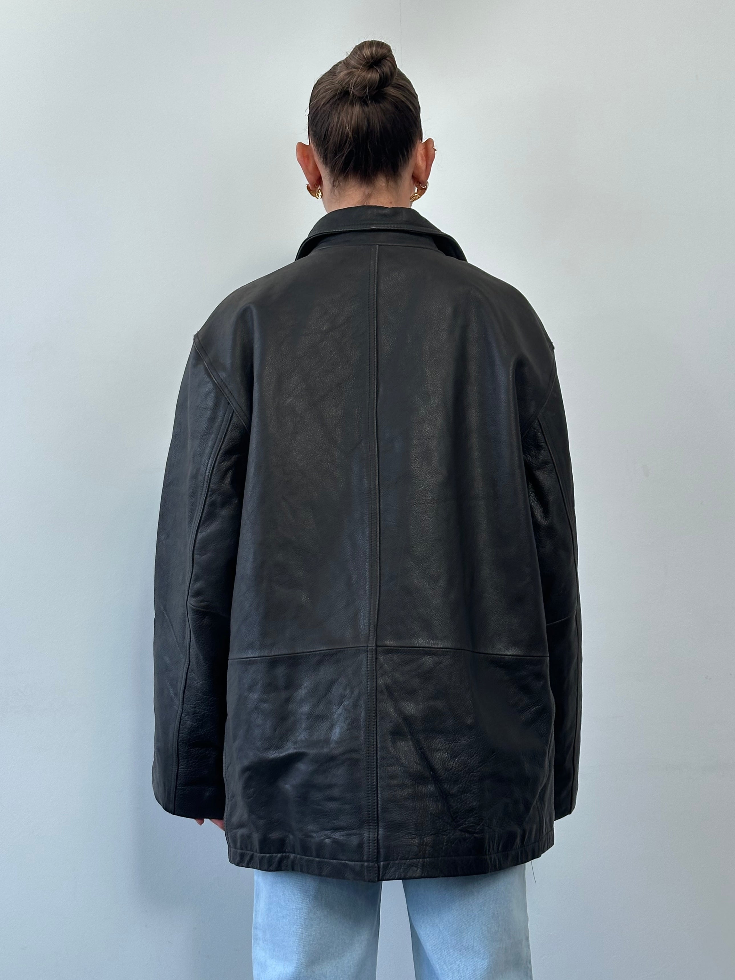 Tommy Hilfiger double-breasted leather jacket in size XL, featuring classic design and dark brown color.