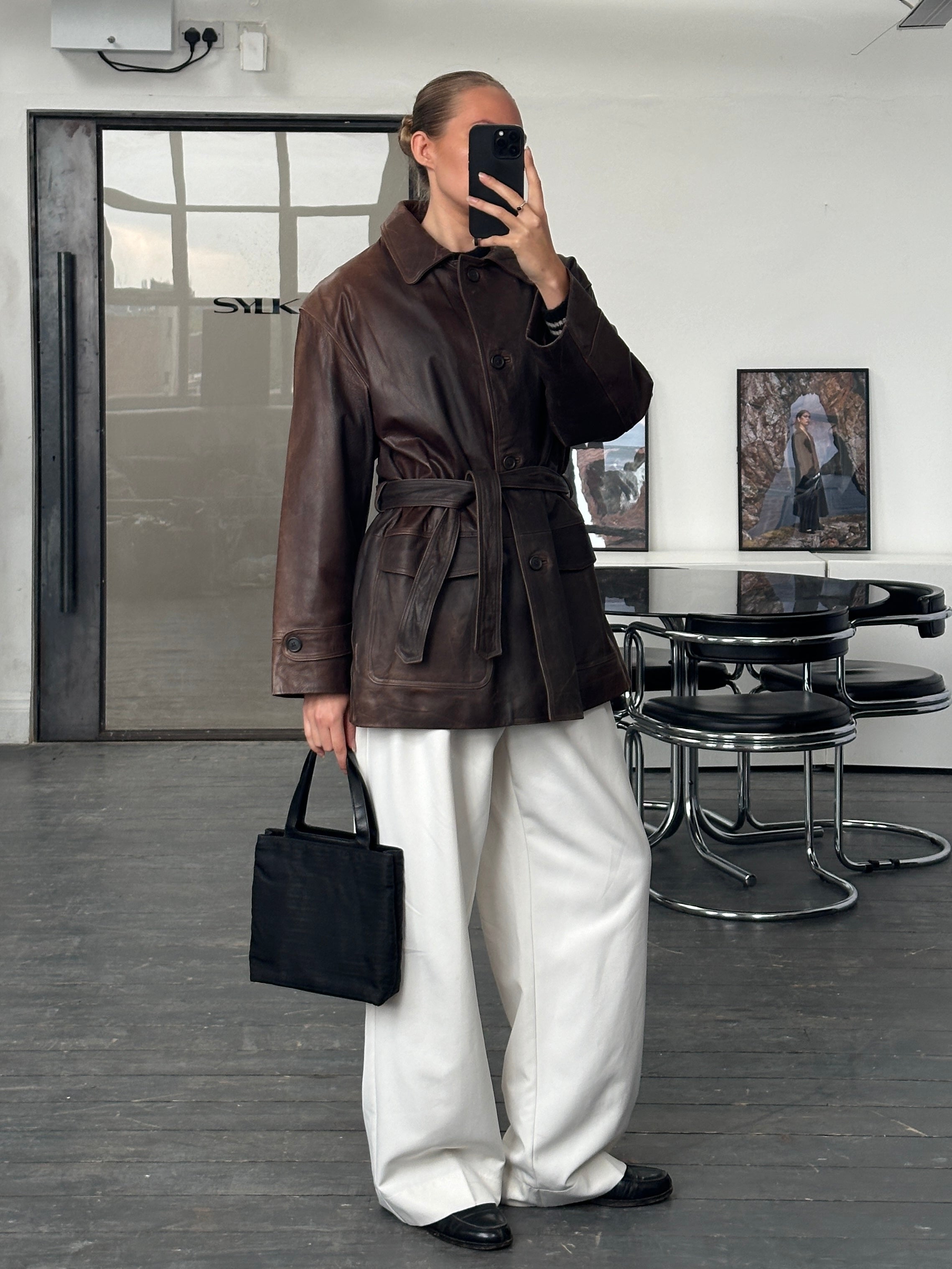 Vintage Italian 1990s belted leather jacket in XL, aged authentic leather with classic vintage styling.