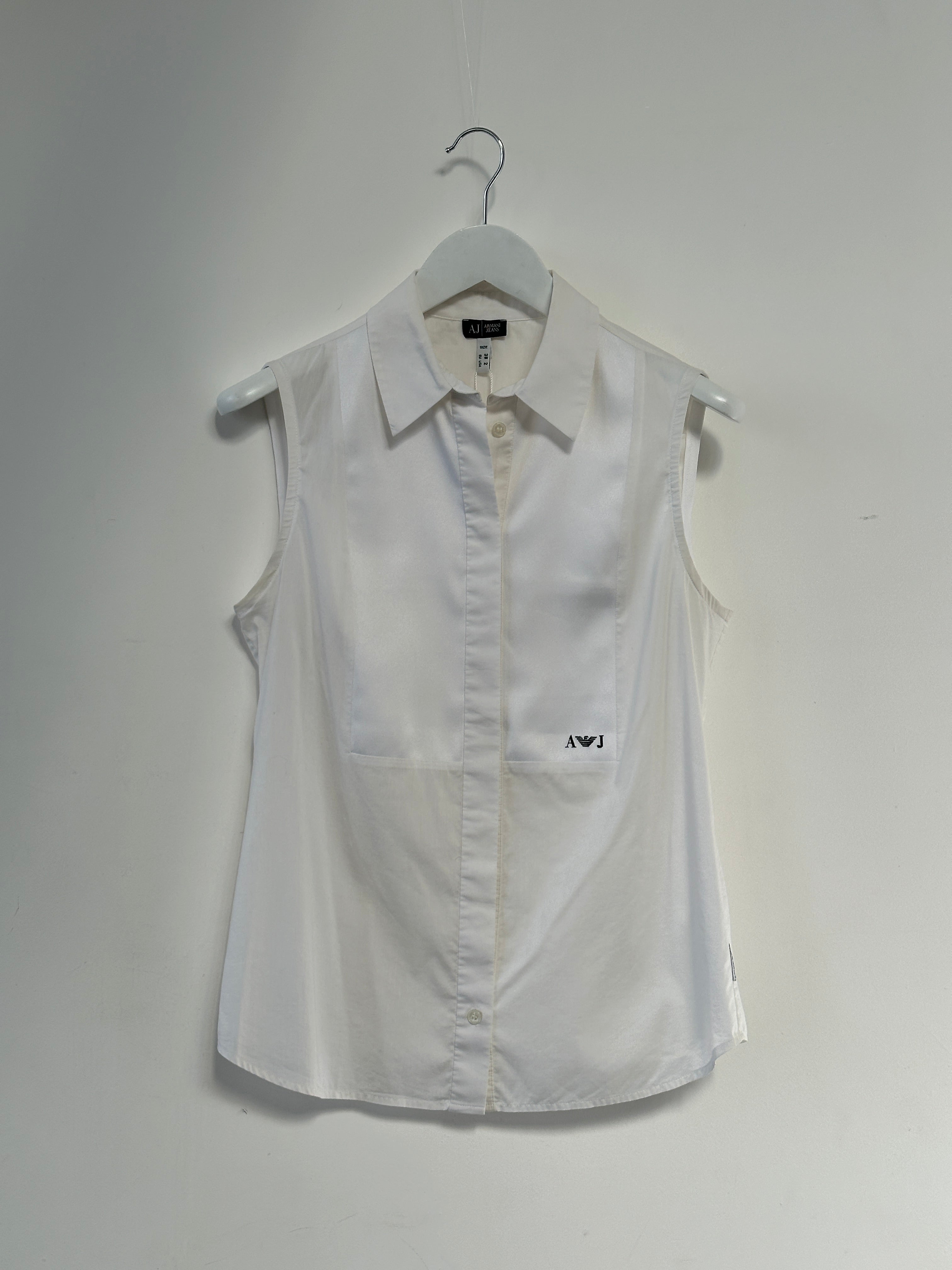 Armani Jeans sleeveless shirt in size S, featuring a stylish design with a classic collar and sleeveless cut, laid flat.