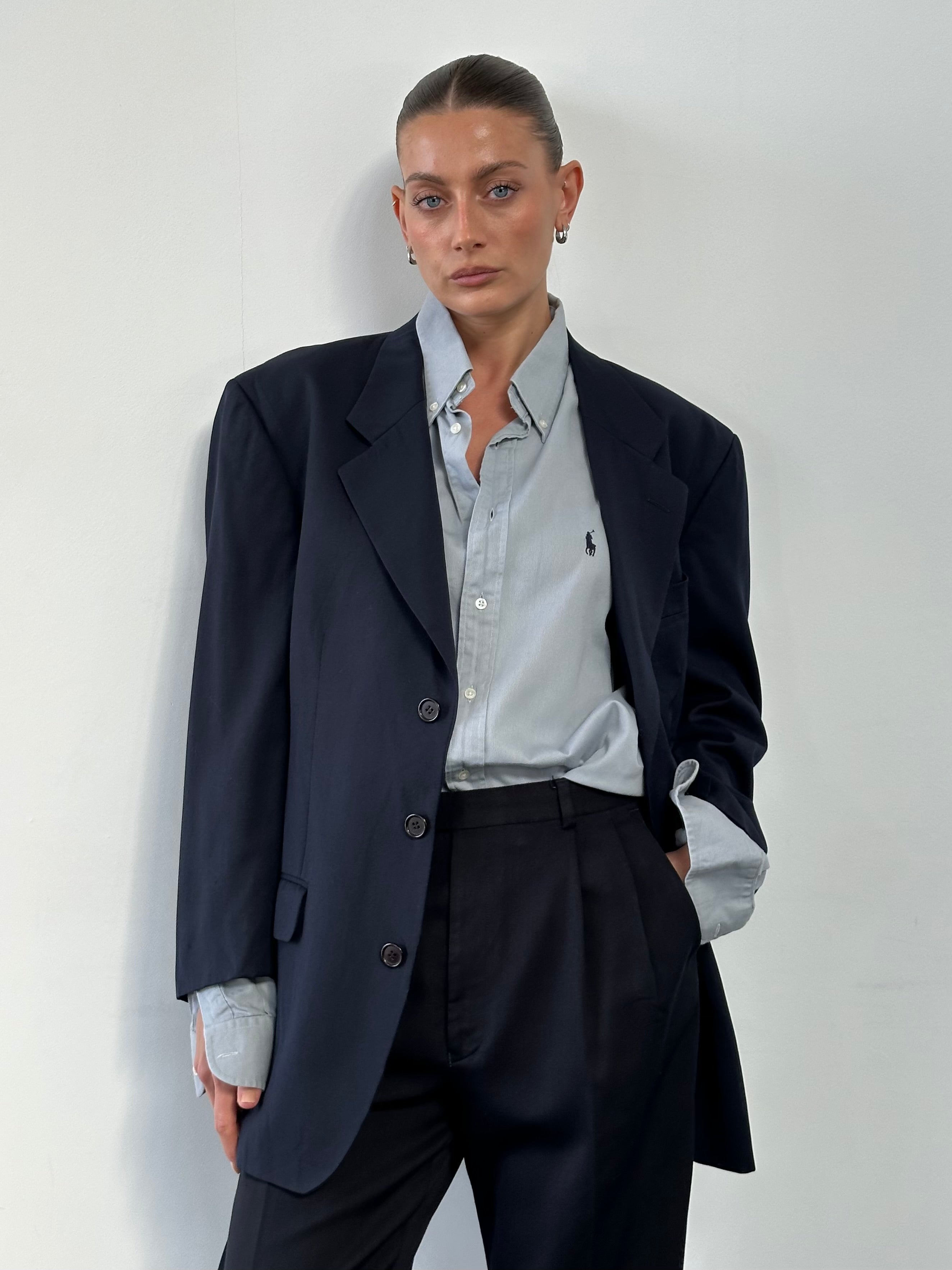 Yves Saint Laurent Pour Homme 1990s wool single-breasted blazer in size L/XL, tailored fit with classic lapels and button closure.