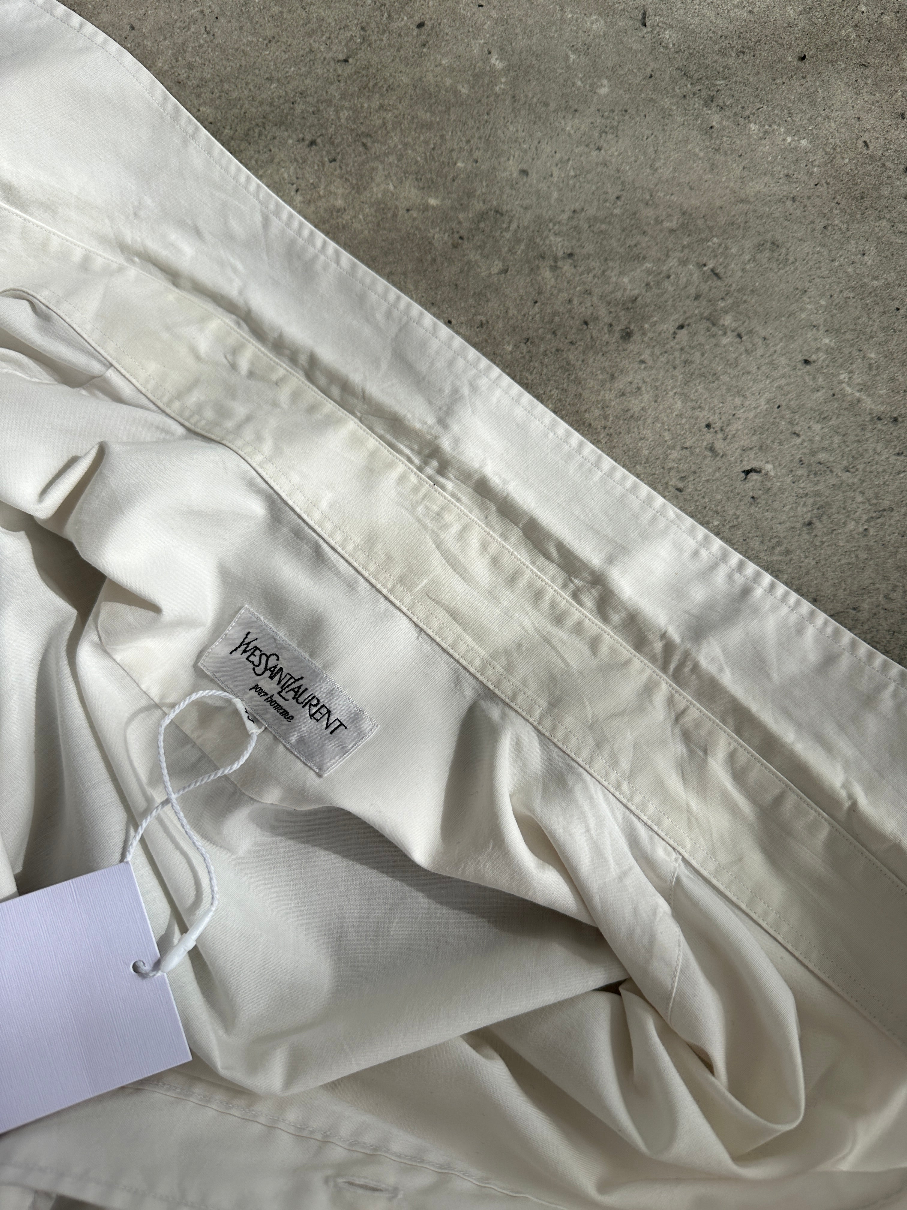Yves Saint Laurent 90s cotton logo shirt in XL, featuring classic YSL branding and a relaxed fit, displayed on a hanger.