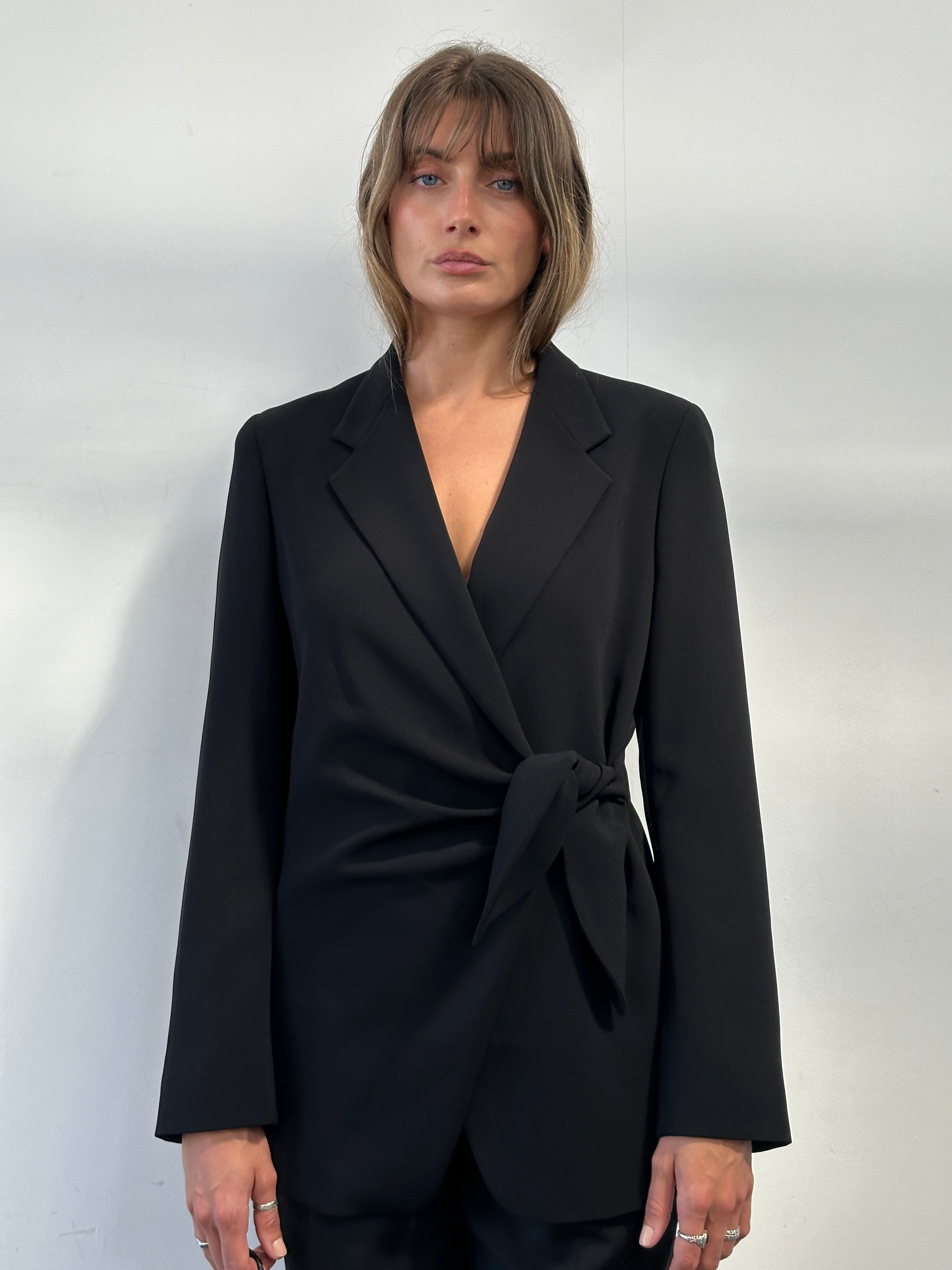 Max Mara tie side blazer in size M, tailored with a structured fit and stylish design, shown in a neutral color.