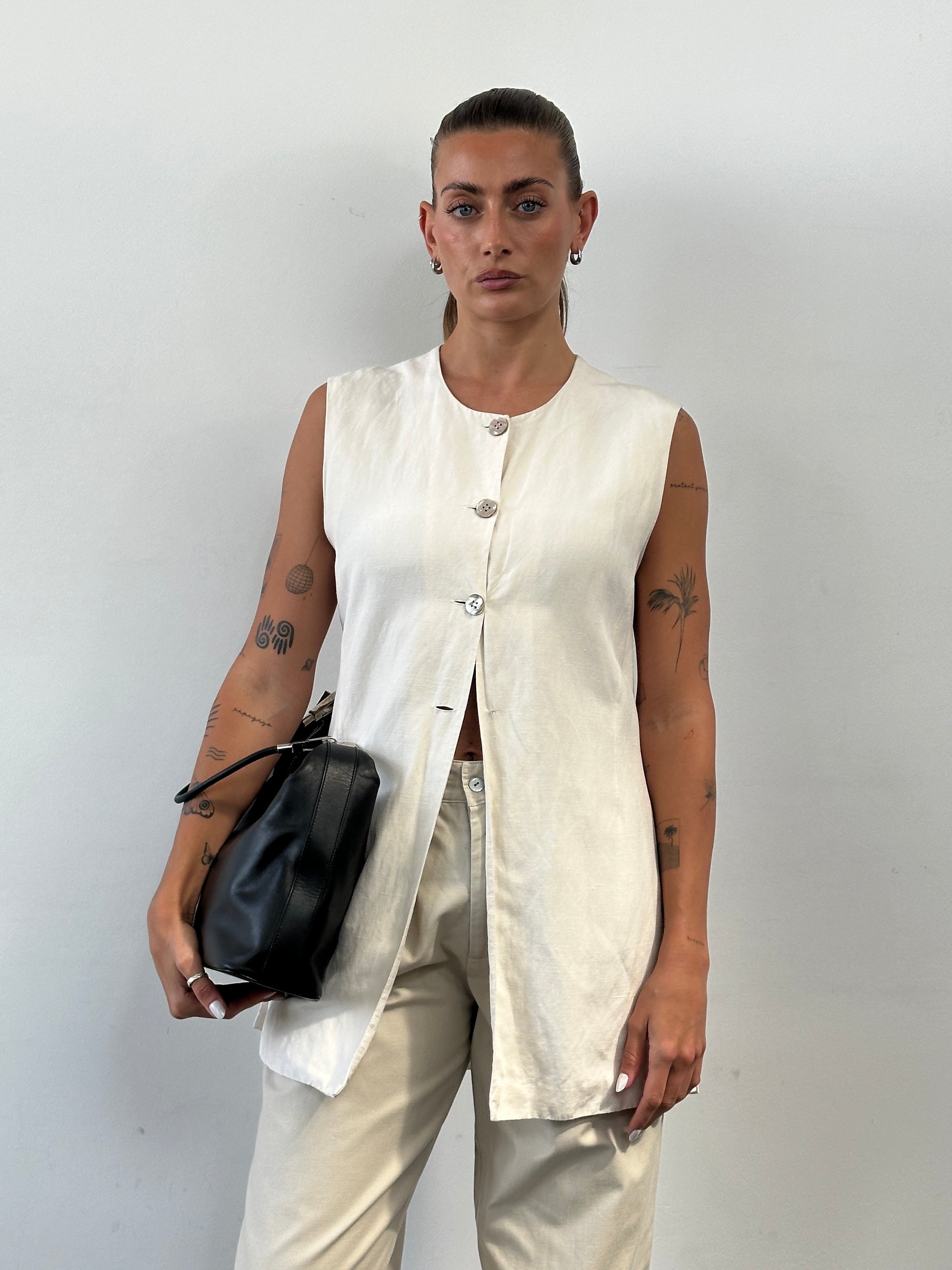 Laura Ashley silk linen waistcoat in size L, featuring a stylish tailored design and lightweight fabric for a sophisticated look.