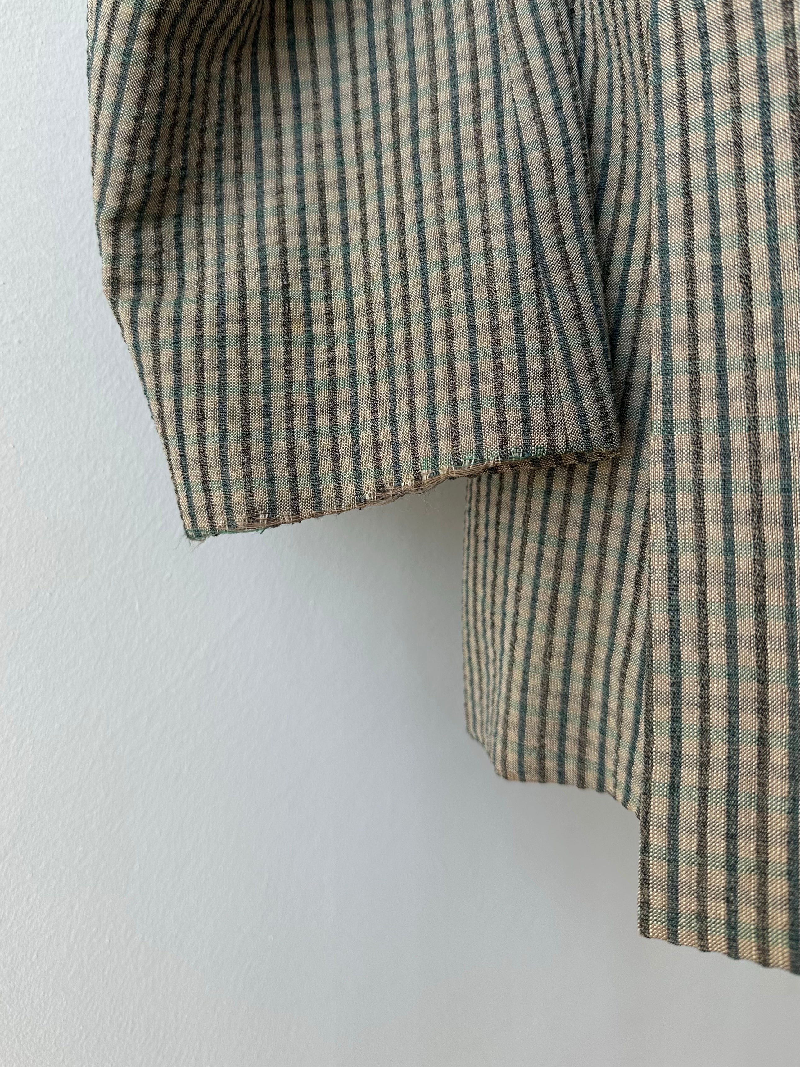 Burberry 1990s wool silk check unlined blazer in size S, featuring classic check pattern and tailored fit with lapel collar.