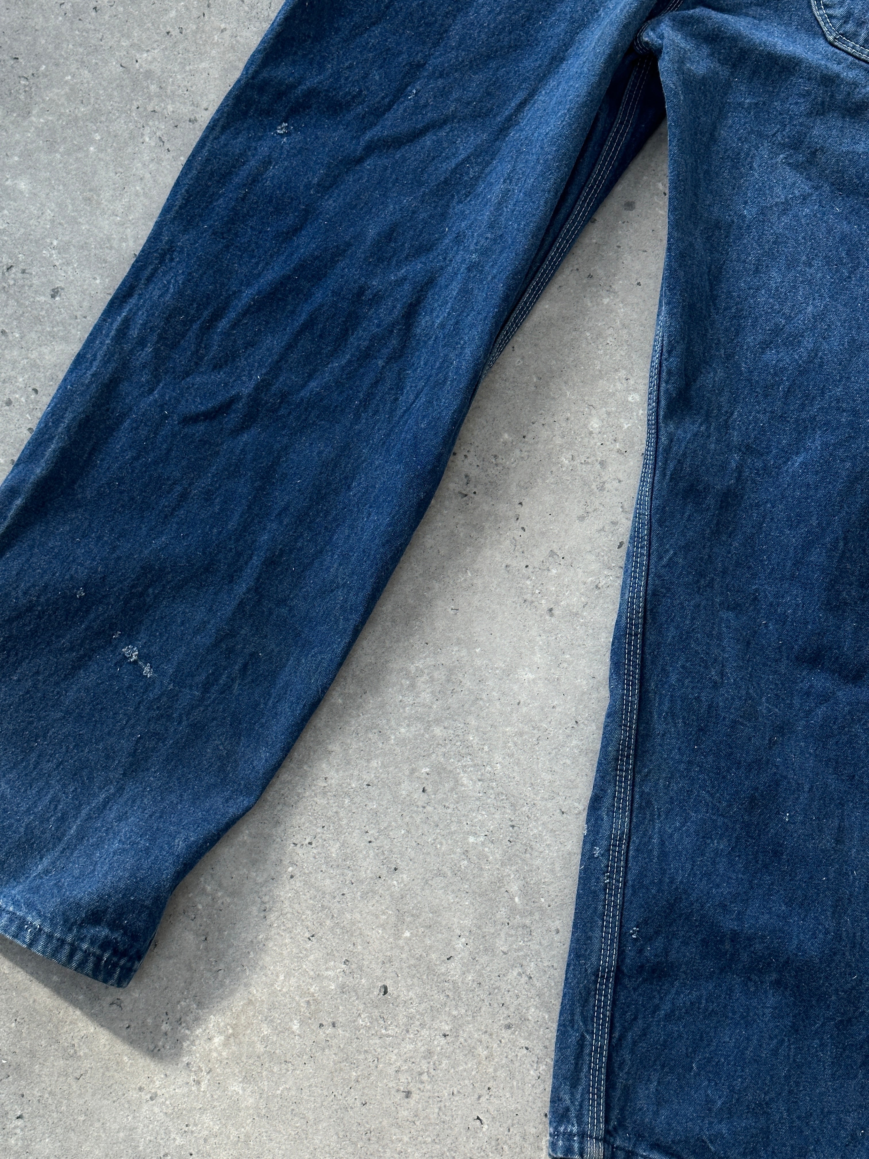 Dickies pure cotton denim dungarees in size XS/S displayed on a hanger showing front view with classic blue denim fabric.
