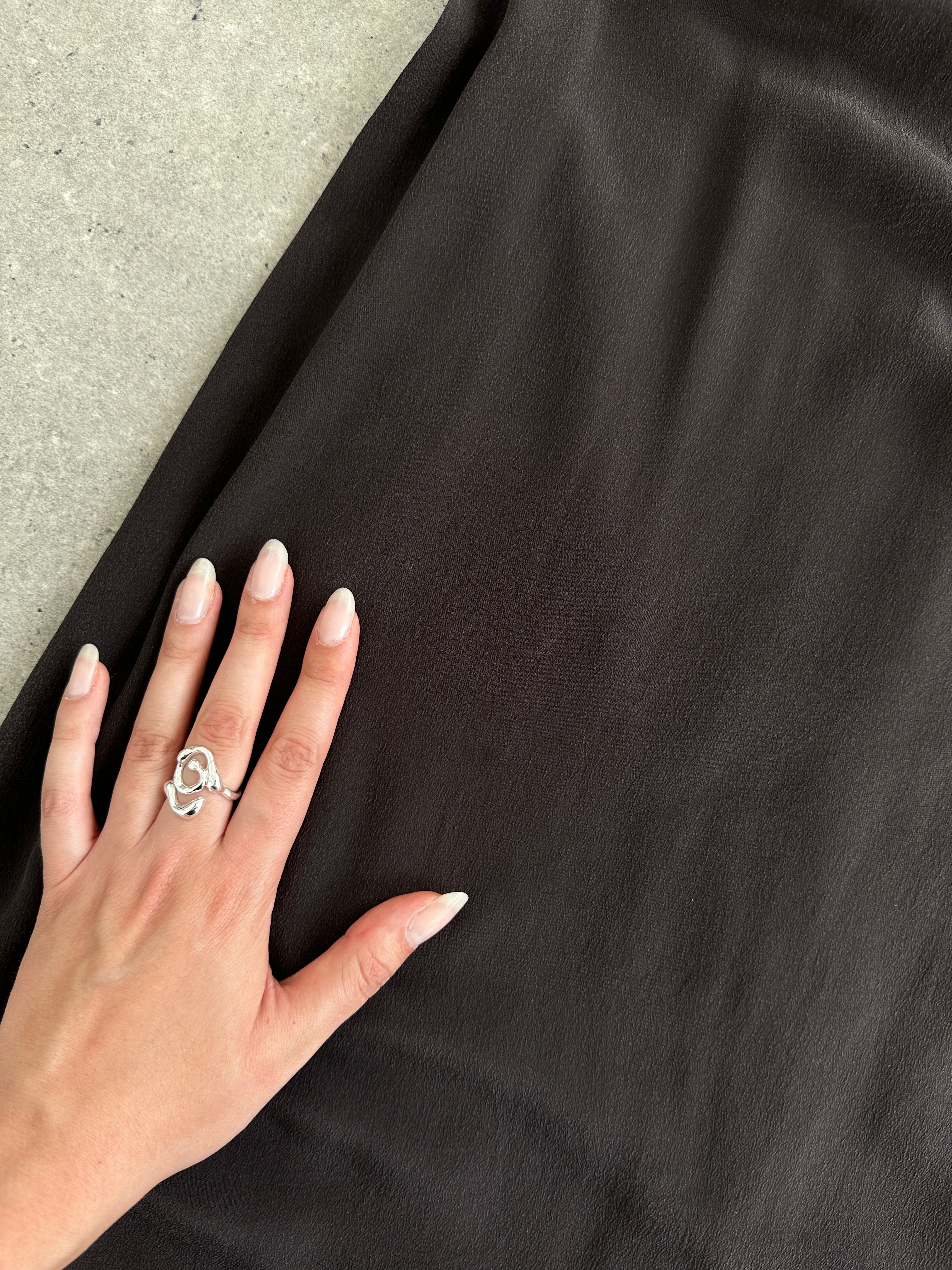 Max Mara S pure silk slip dress shown on a hanger, elegant sleeveless design in smooth, shiny silk fabric.