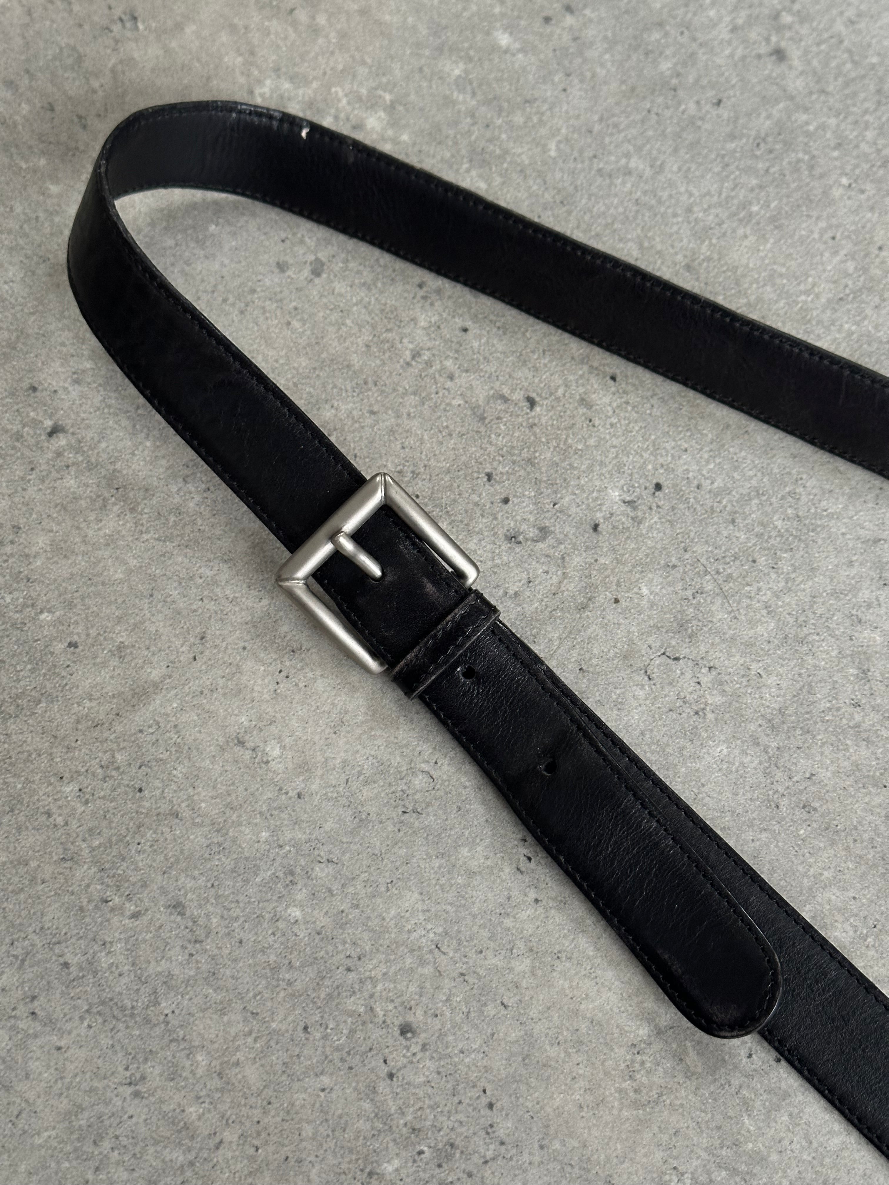 Giorgio Armani Le Collezioni leather crossbody bag in classic design with adjustable strap and subtle branding.