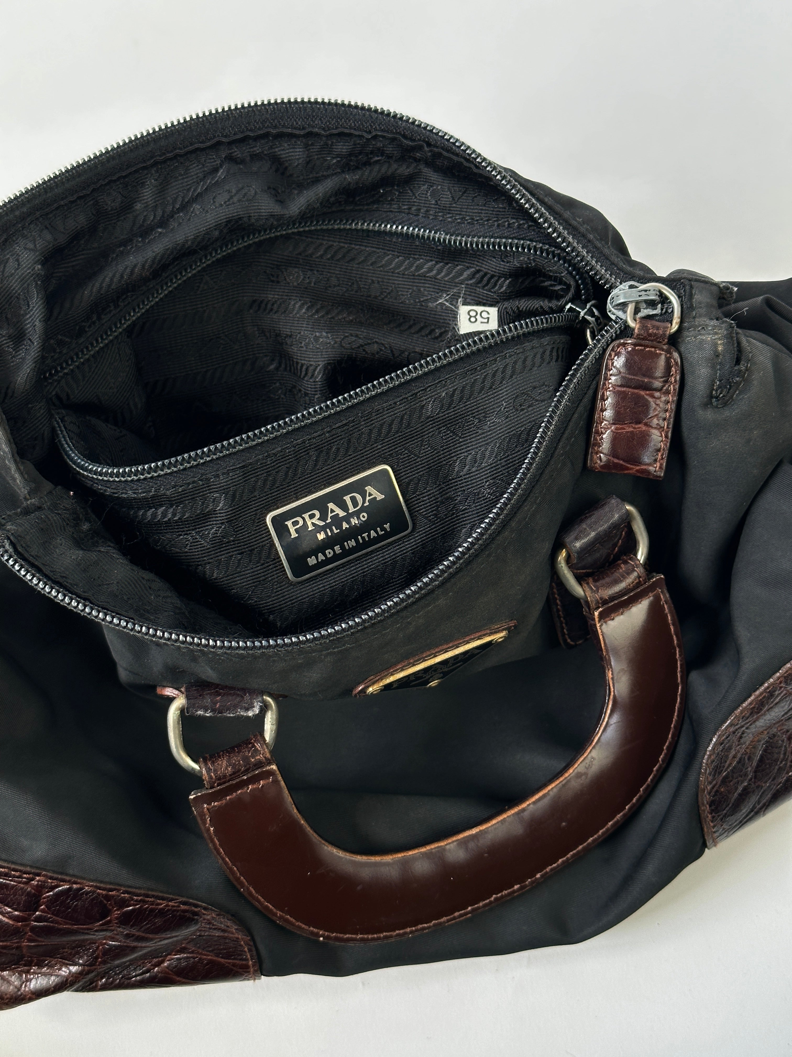 Prada nylon croc handbag with sleek design, featuring textured croc pattern and sturdy nylon straps.
