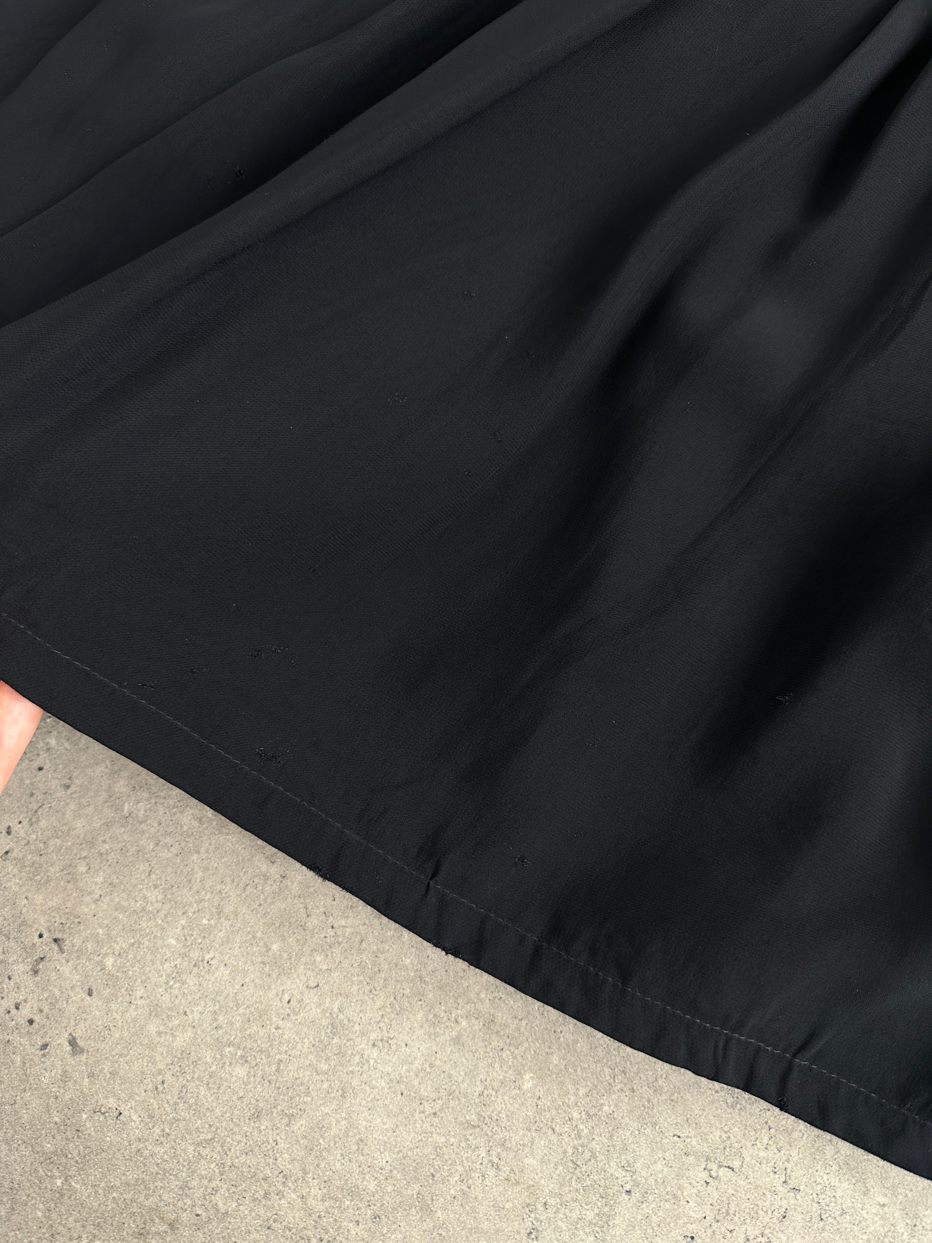Iceberg pleated belted midi skirt in W28, shown in light fabric with a high waist and flowing pleats, styled for a chic look.